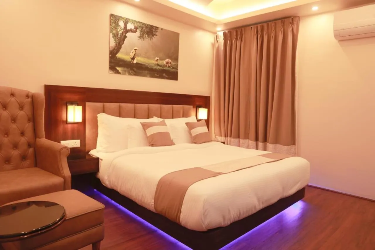 Bed in XCELSIOR HOTEL & SPA