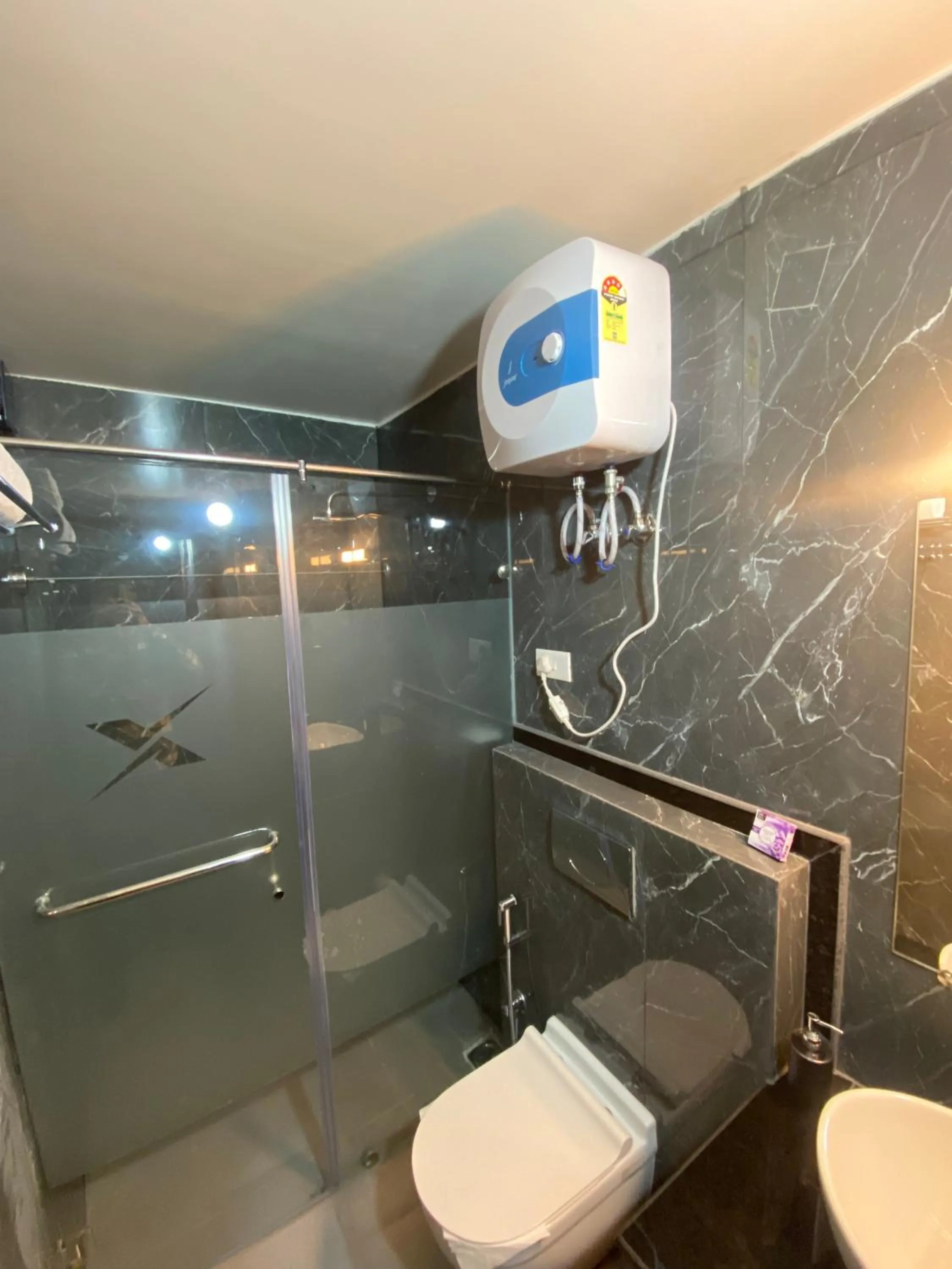 Shower in XCELSIOR HOTEL & SPA