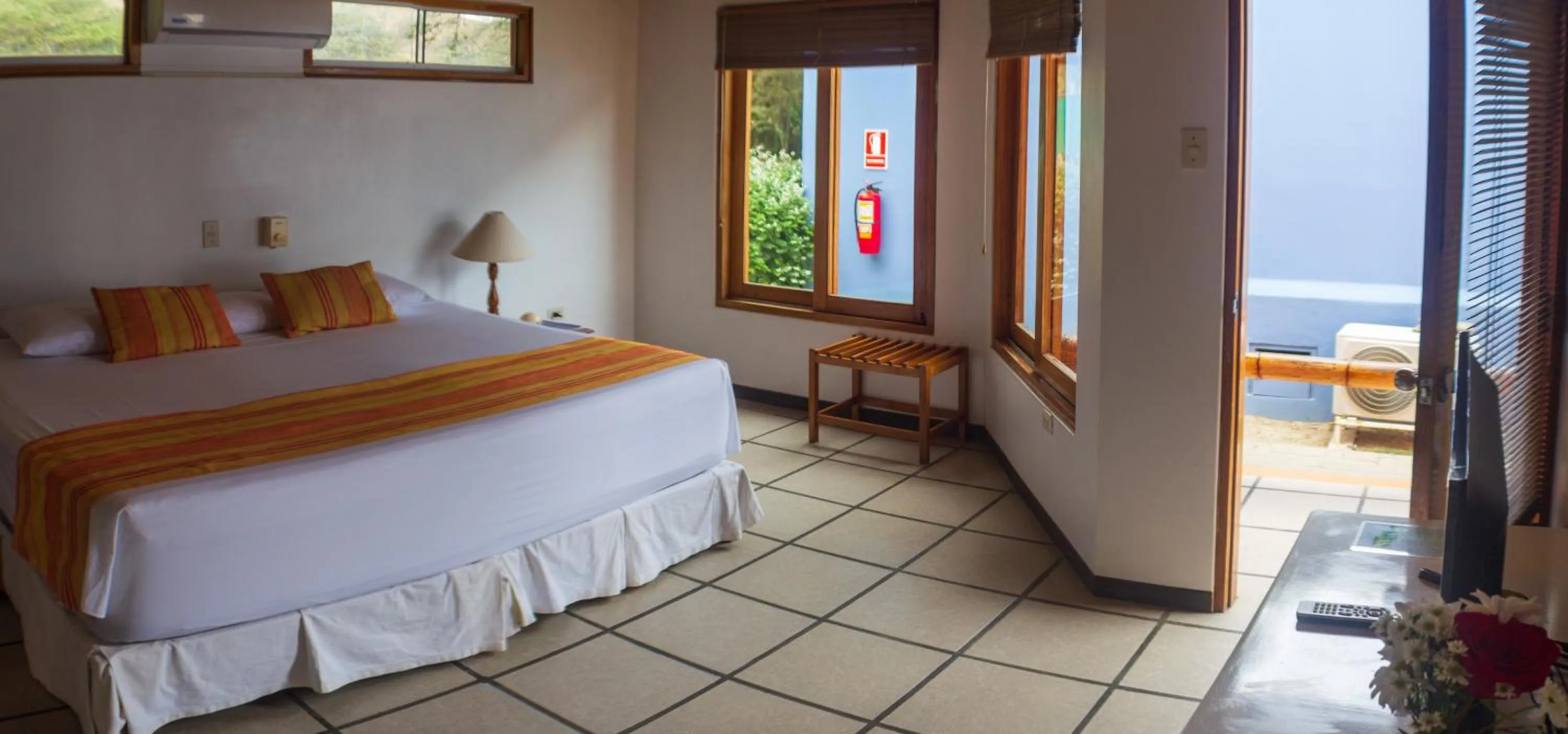 Bed in Punta Sal Suites & Bungalows Resort