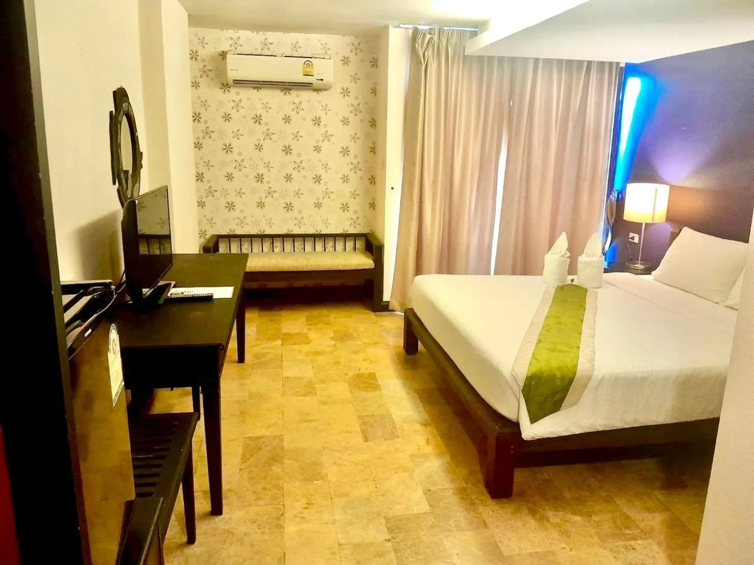 Bed in All Together Suite Hotel