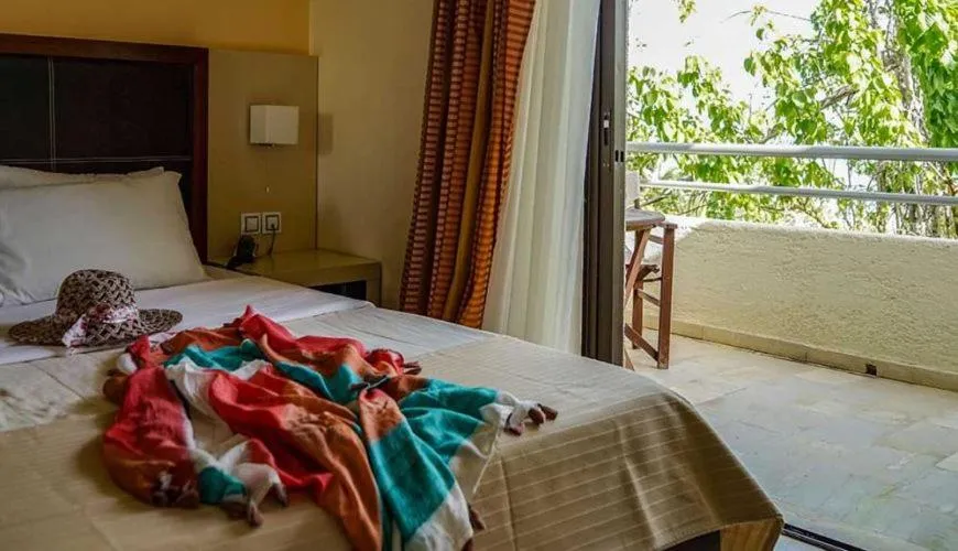 Bed in GOLDEN SUN Κokkoni Beach Hotel