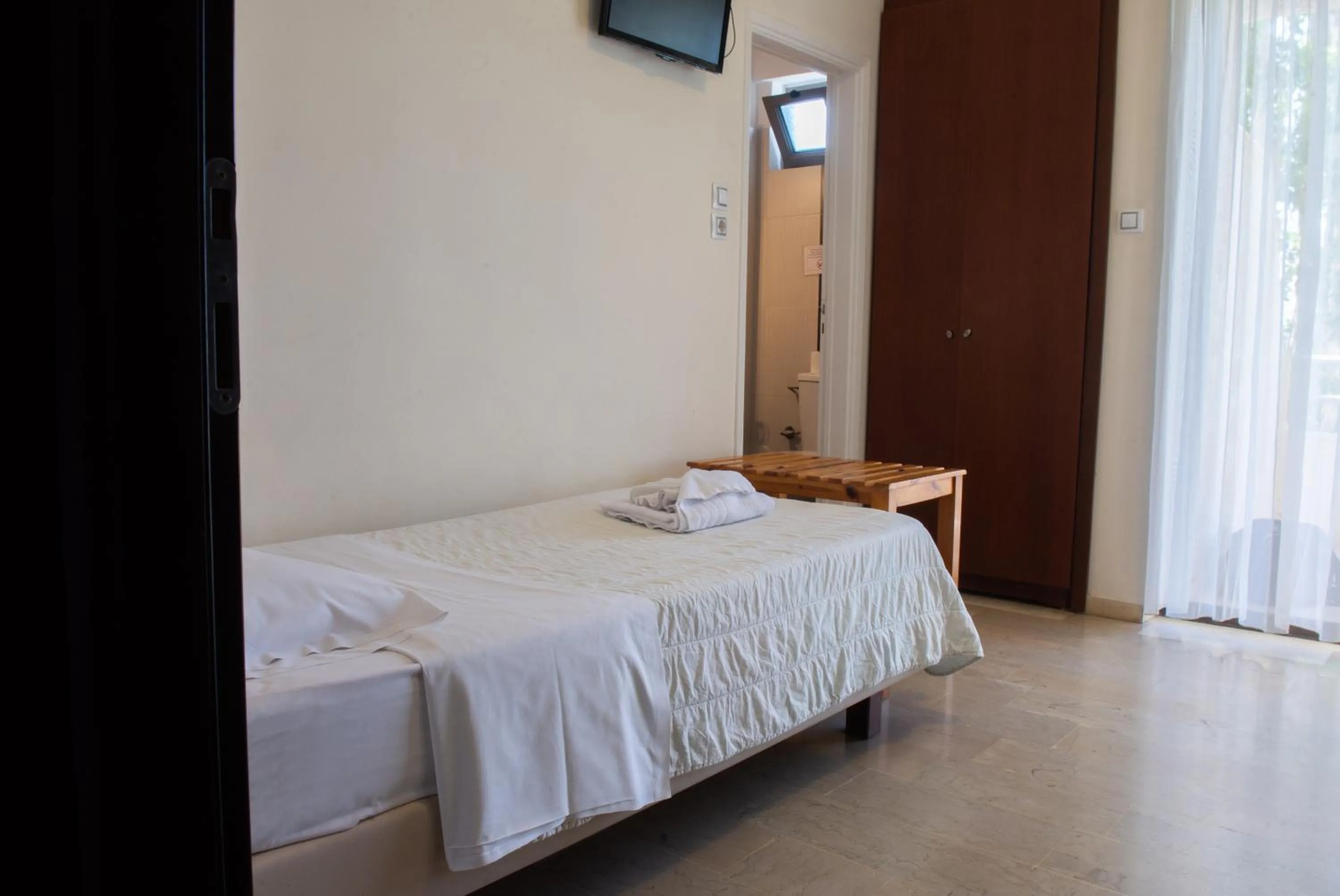 Bed in GOLDEN SUN Κokkoni Beach Hotel