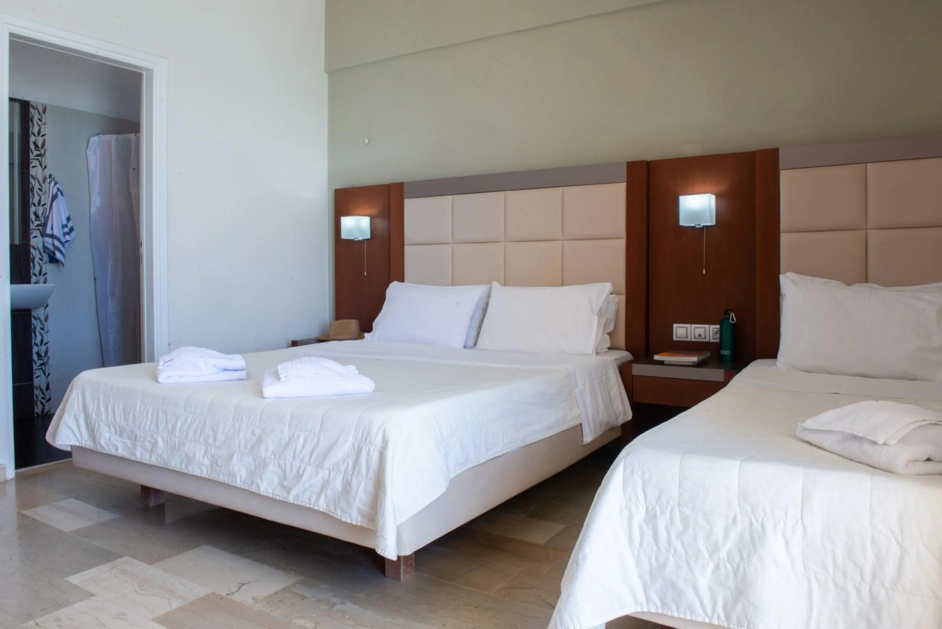 Bed in GOLDEN SUN Κokkoni Beach Hotel