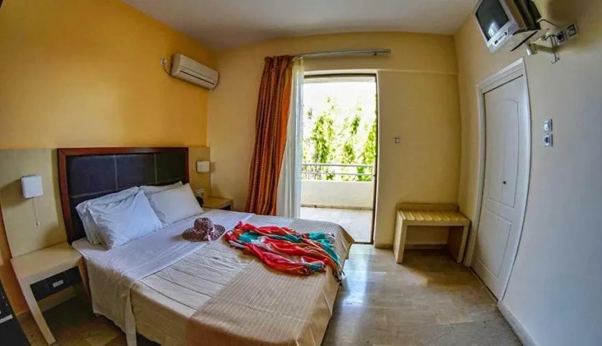 Bed in GOLDEN SUN Κokkoni Beach Hotel