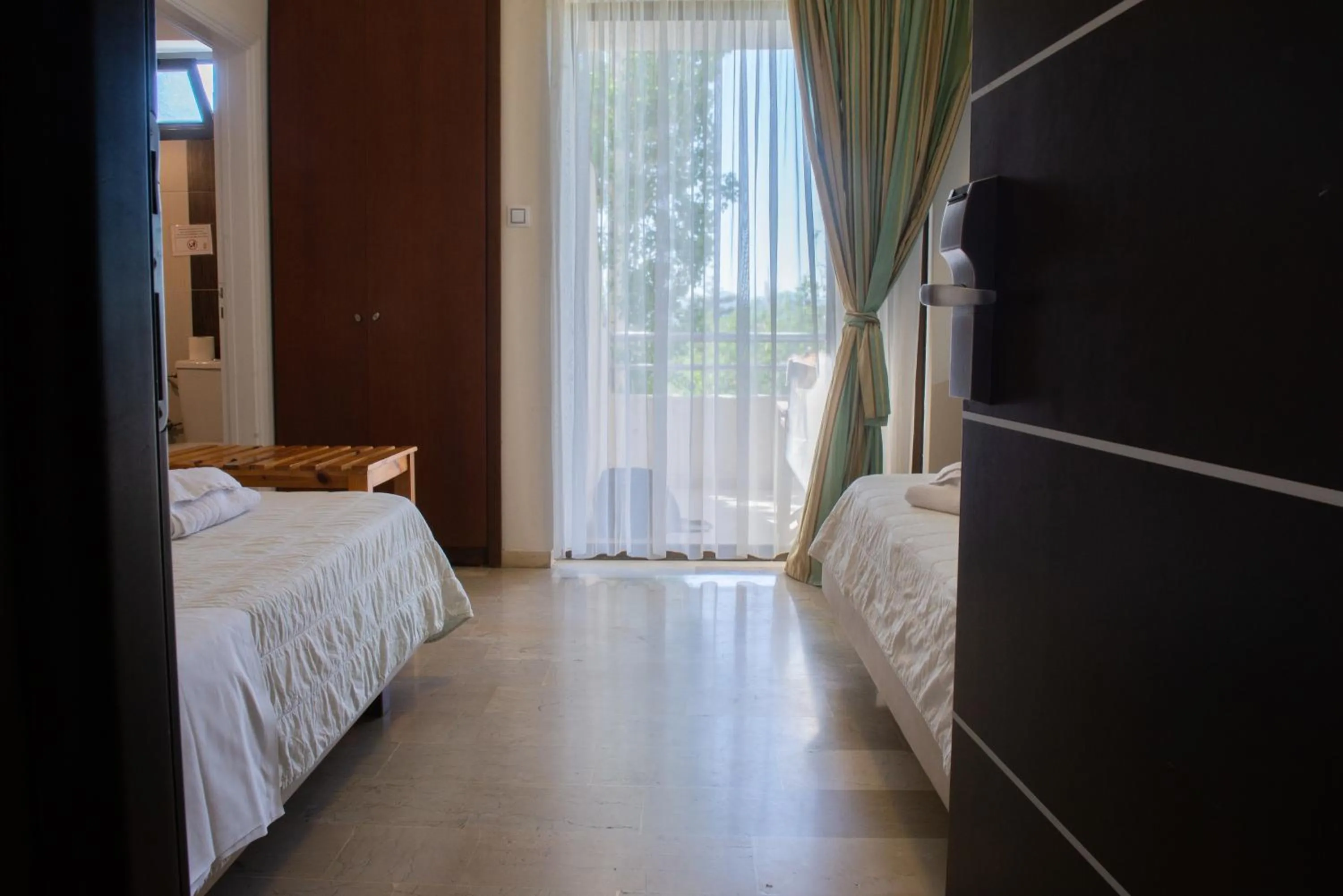 Bed in GOLDEN SUN Κokkoni Beach Hotel