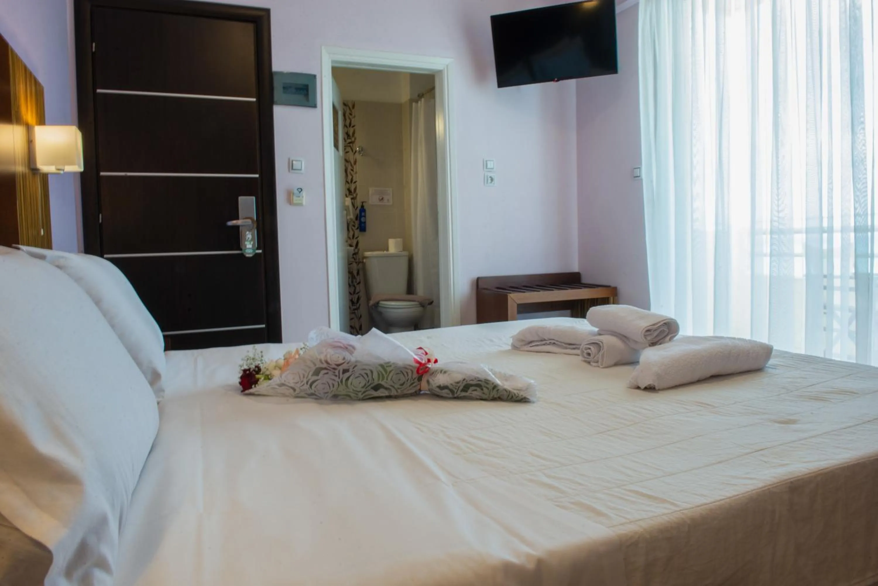 Bed in GOLDEN SUN Κokkoni Beach Hotel