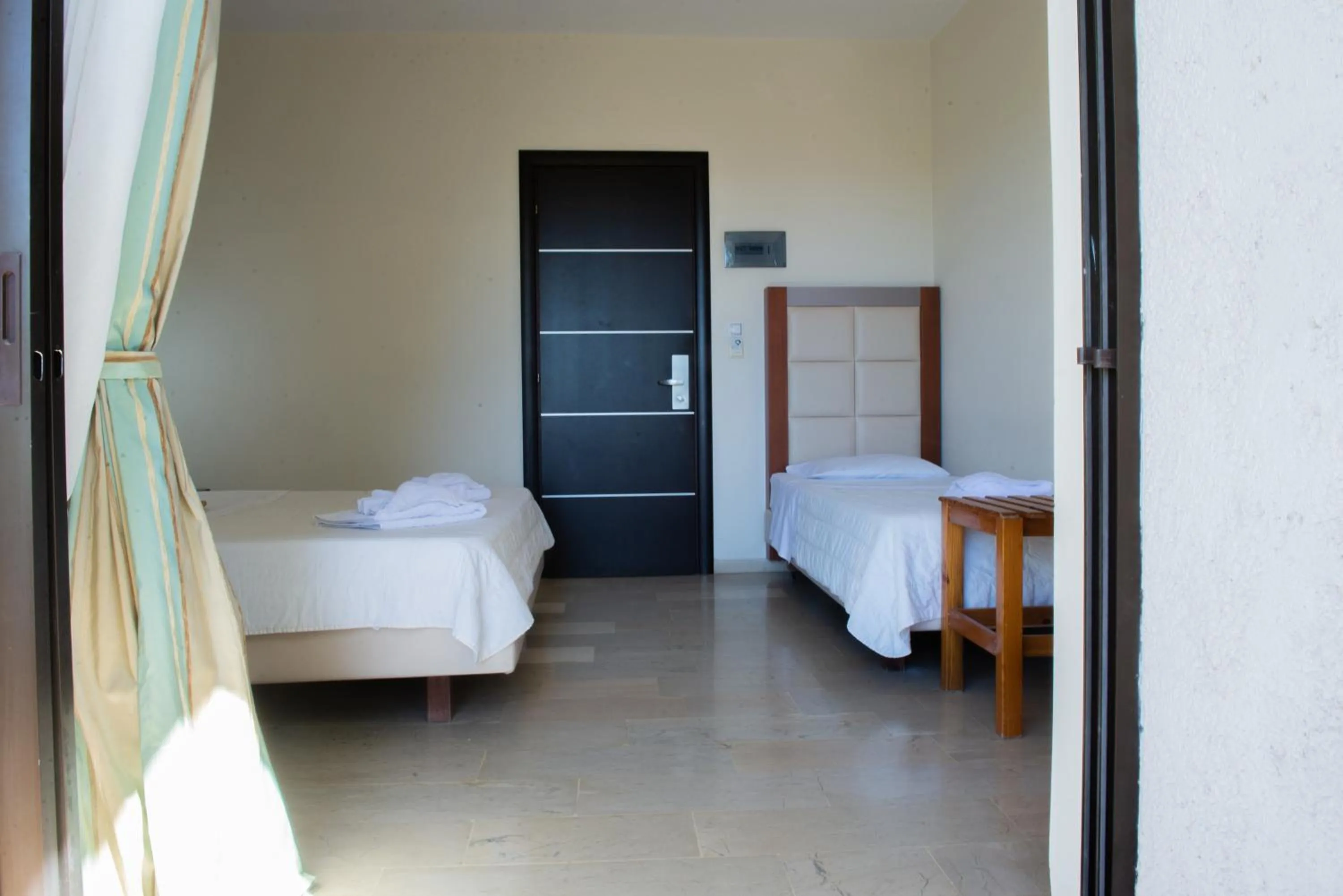 Bed in GOLDEN SUN Κokkoni Beach Hotel