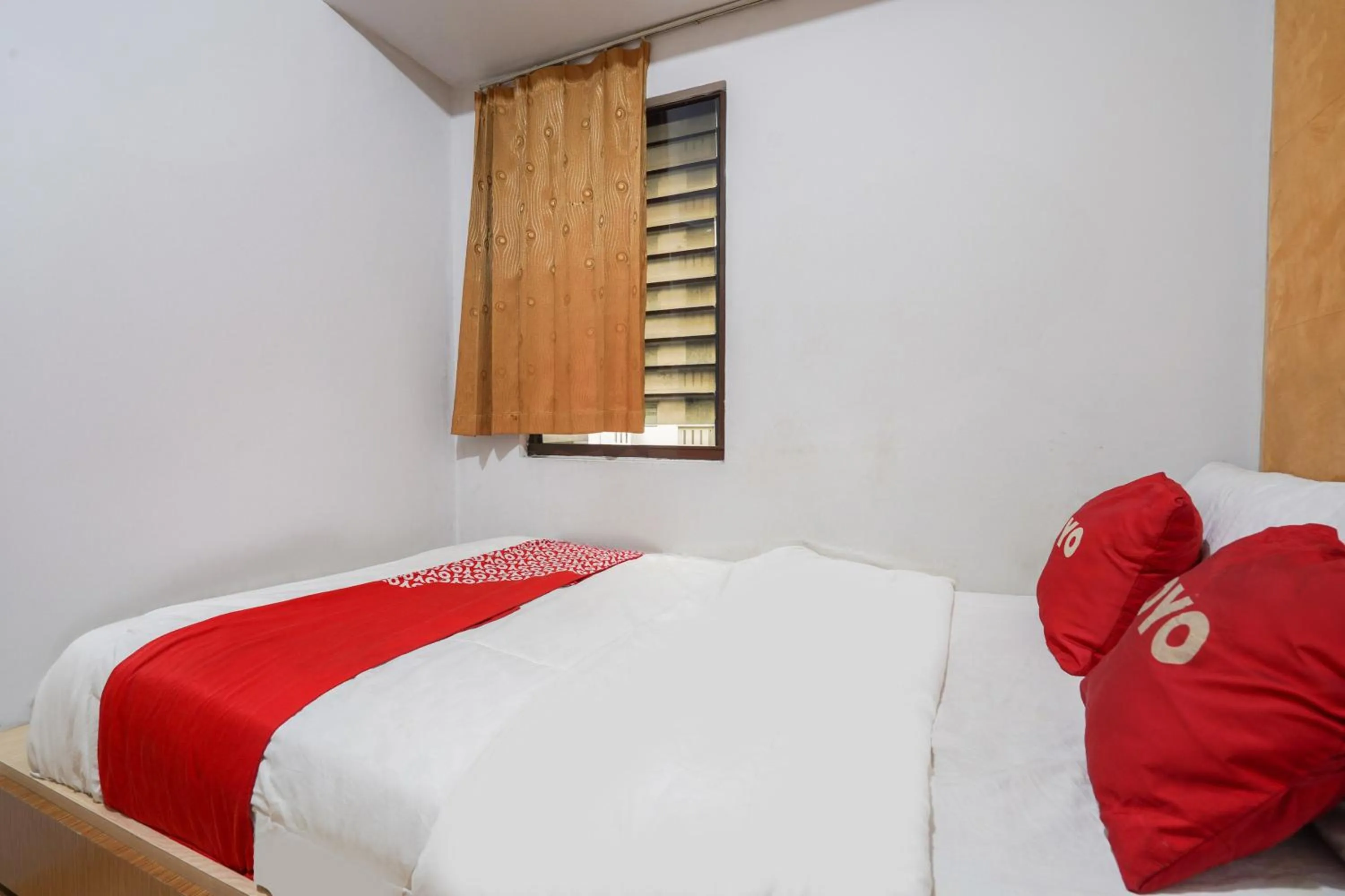 Bedroom in OYO 93545 Gateway Cicadas Apartment By Barbie Homestay