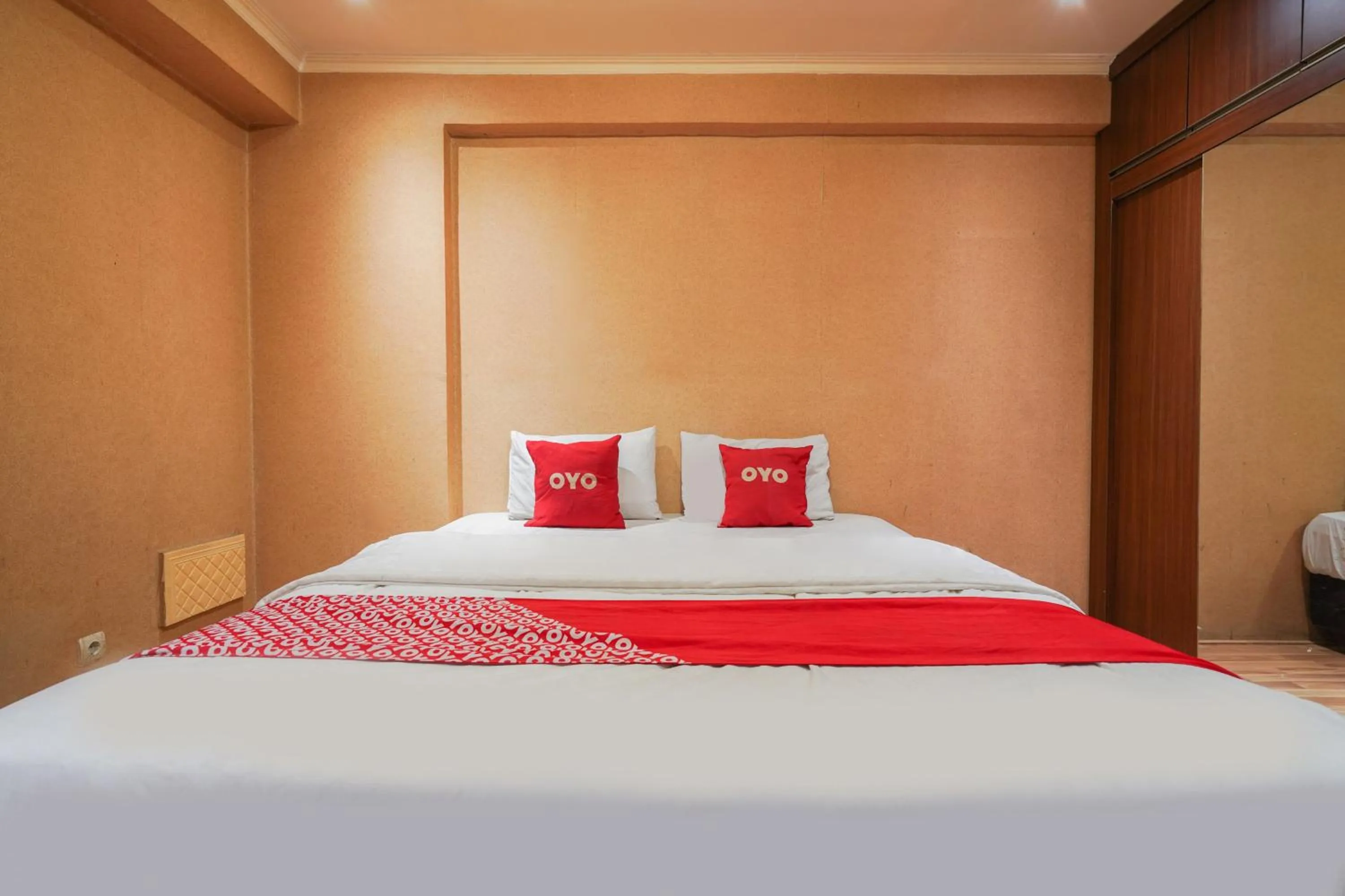 Bedroom in OYO 93545 Gateway Cicadas Apartment By Barbie Homestay