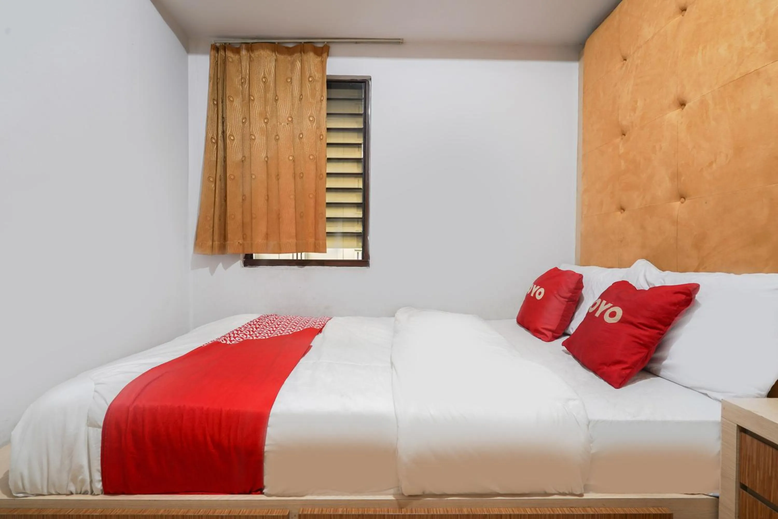 Bedroom in OYO 93545 Gateway Cicadas Apartment By Barbie Homestay