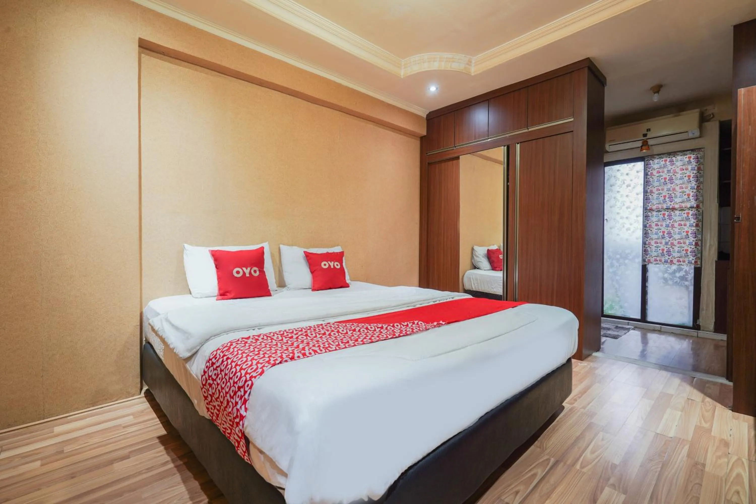 Bedroom in OYO 93545 Gateway Cicadas Apartment By Barbie Homestay