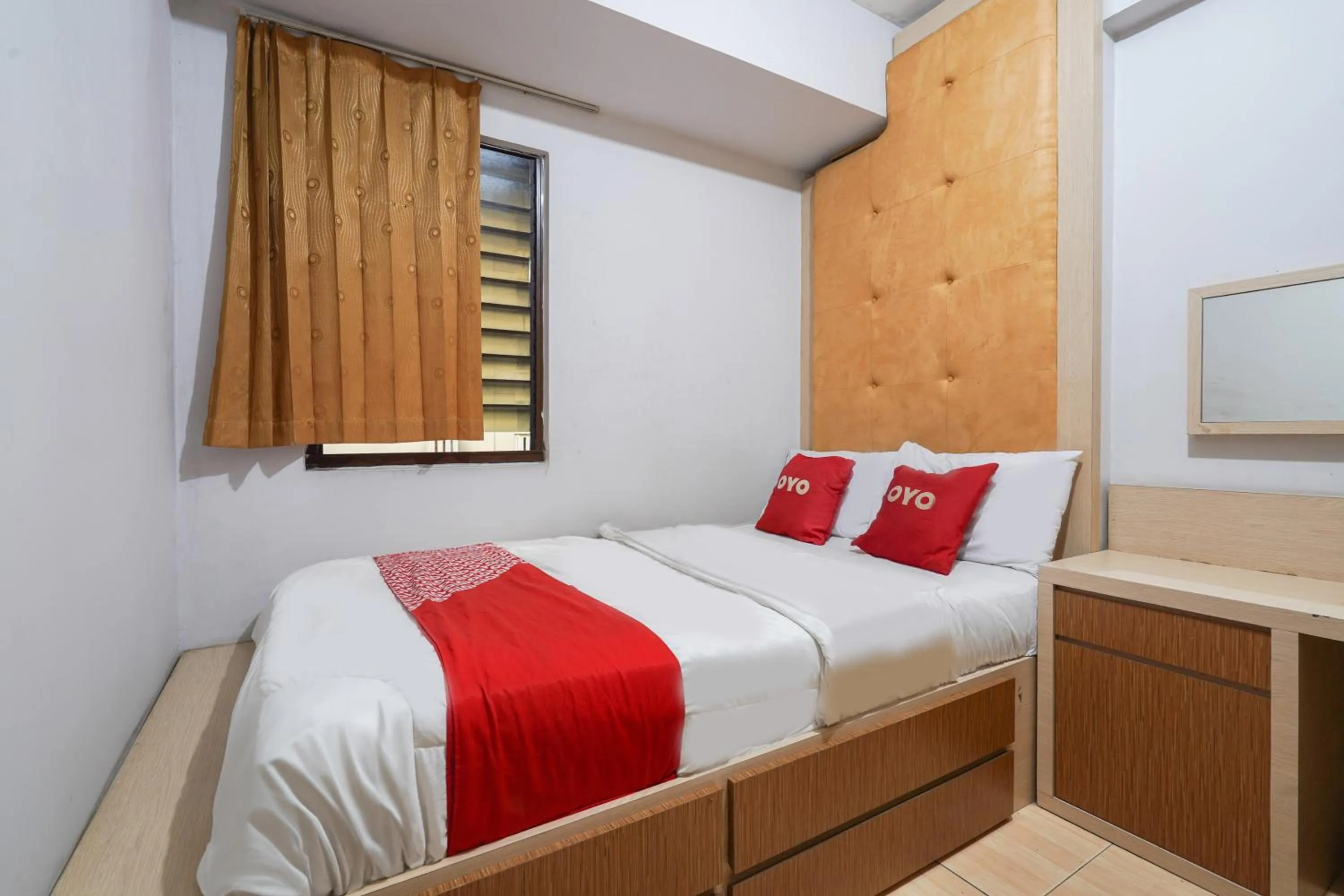 Bedroom in OYO 93545 Gateway Cicadas Apartment By Barbie Homestay