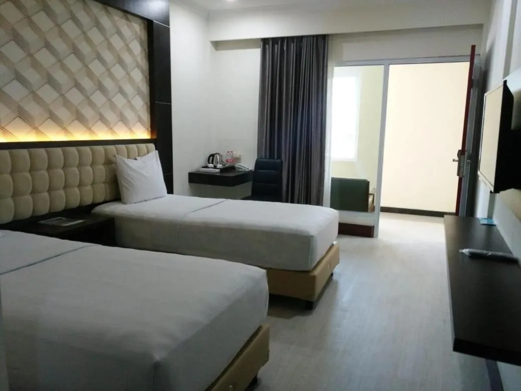 Bedroom in Sindoro Hotel Cilacap By Conary
