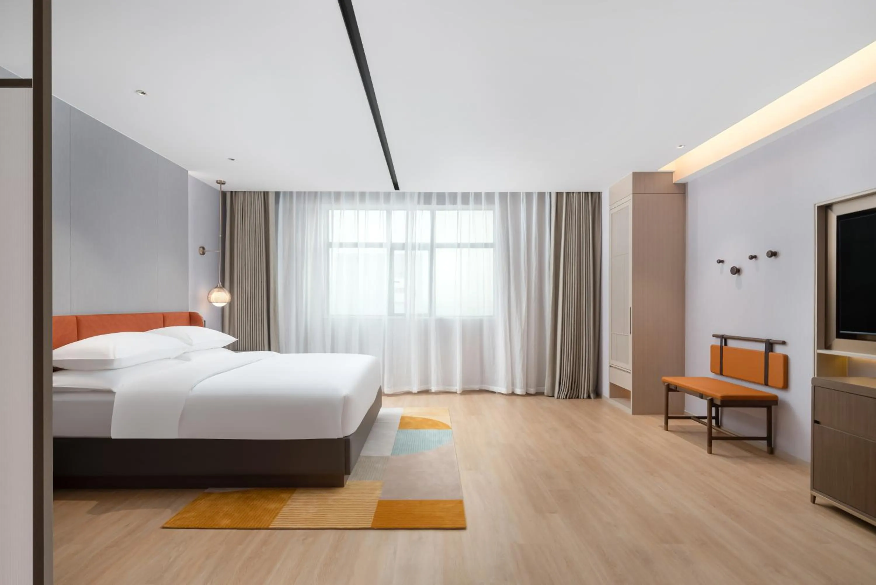 Bed in Home2 Suite by Hilton Dongguan Shijie