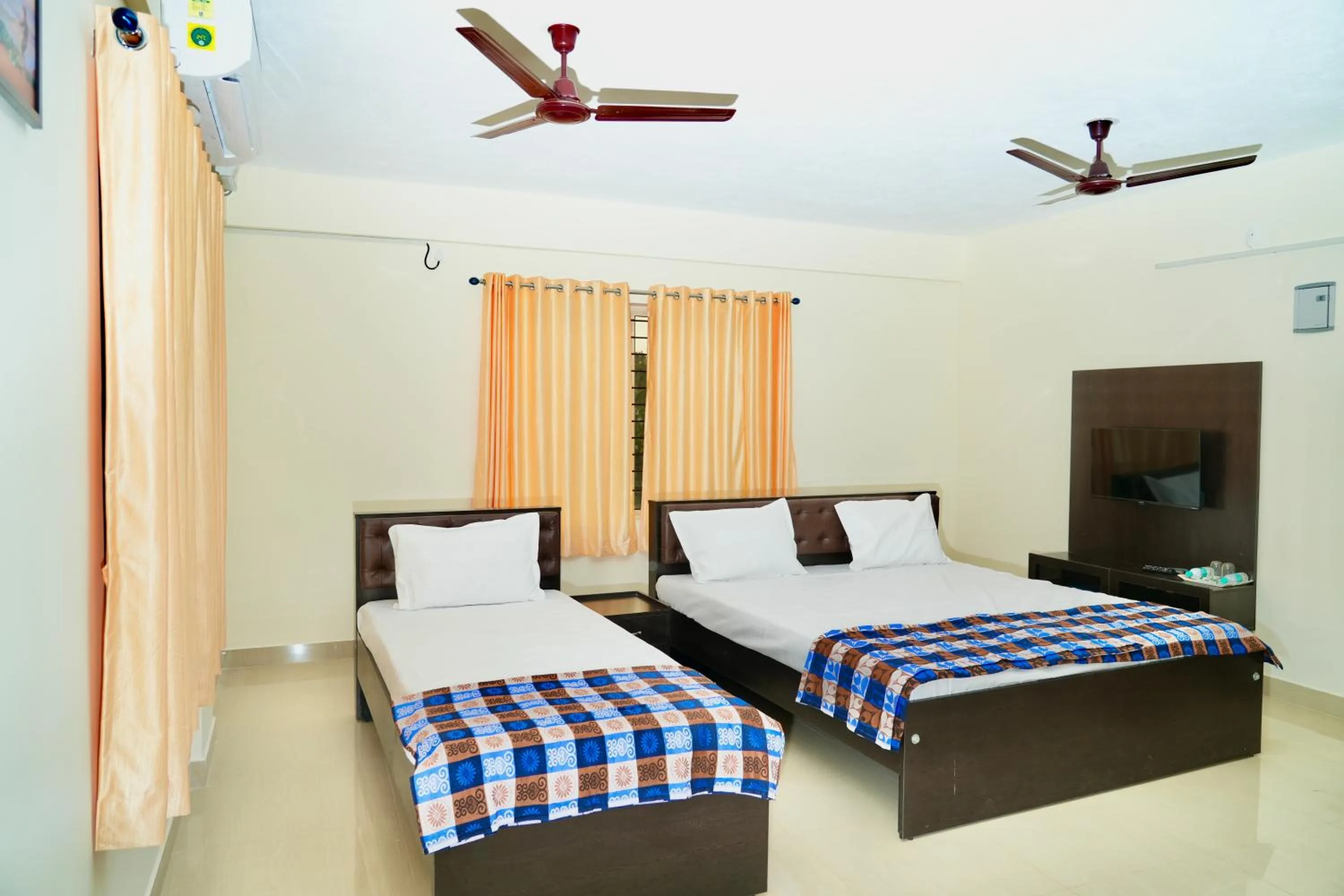 Photo of the whole room, Bed in Shree Swarna Comforts