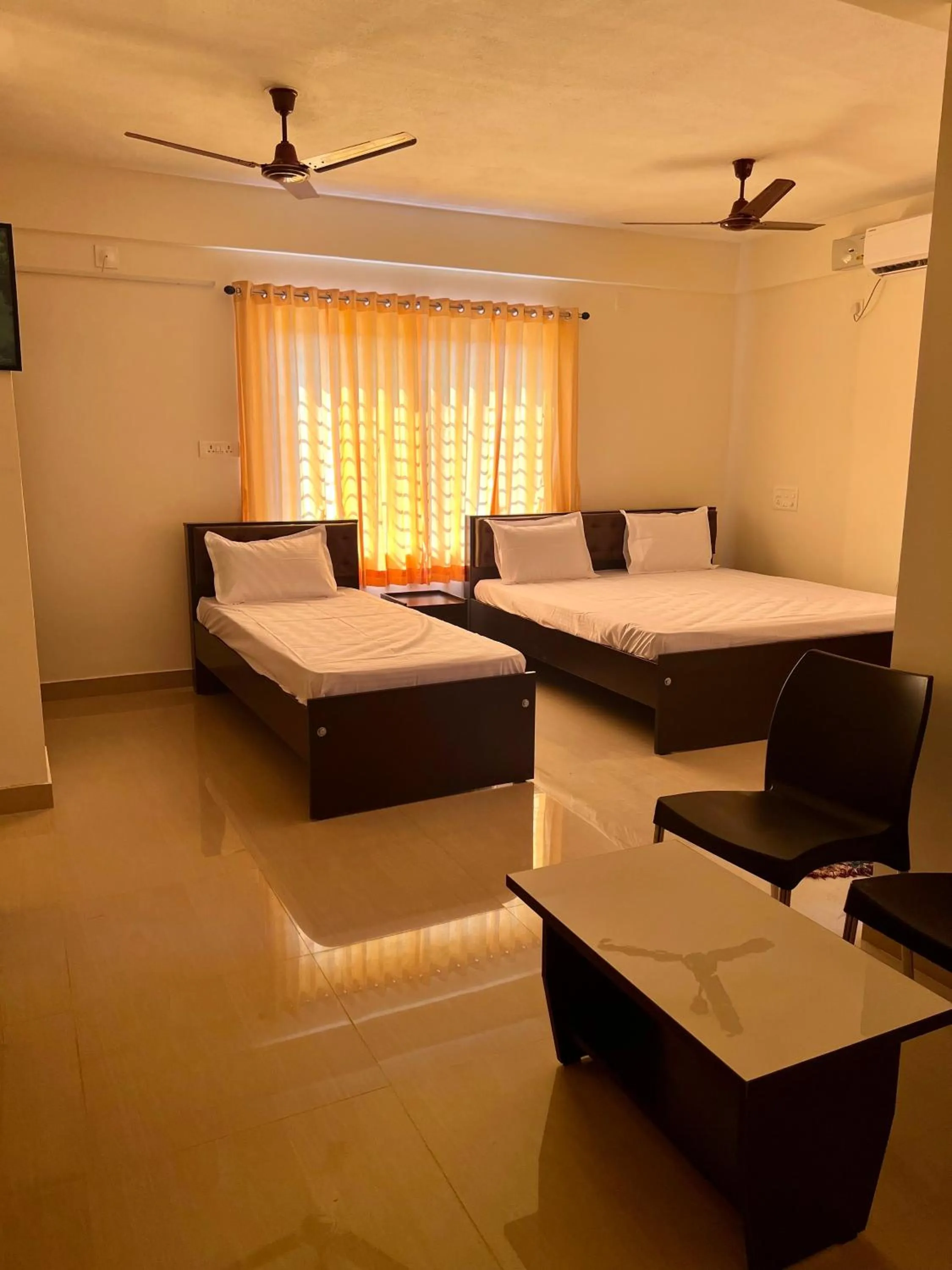 Photo of the whole room, Bed in Shree Swarna Comforts