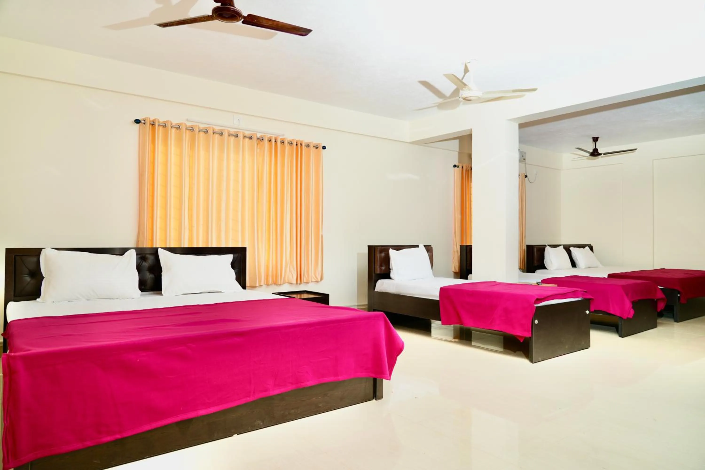 Photo of the whole room, Bed in Shree Swarna Comforts