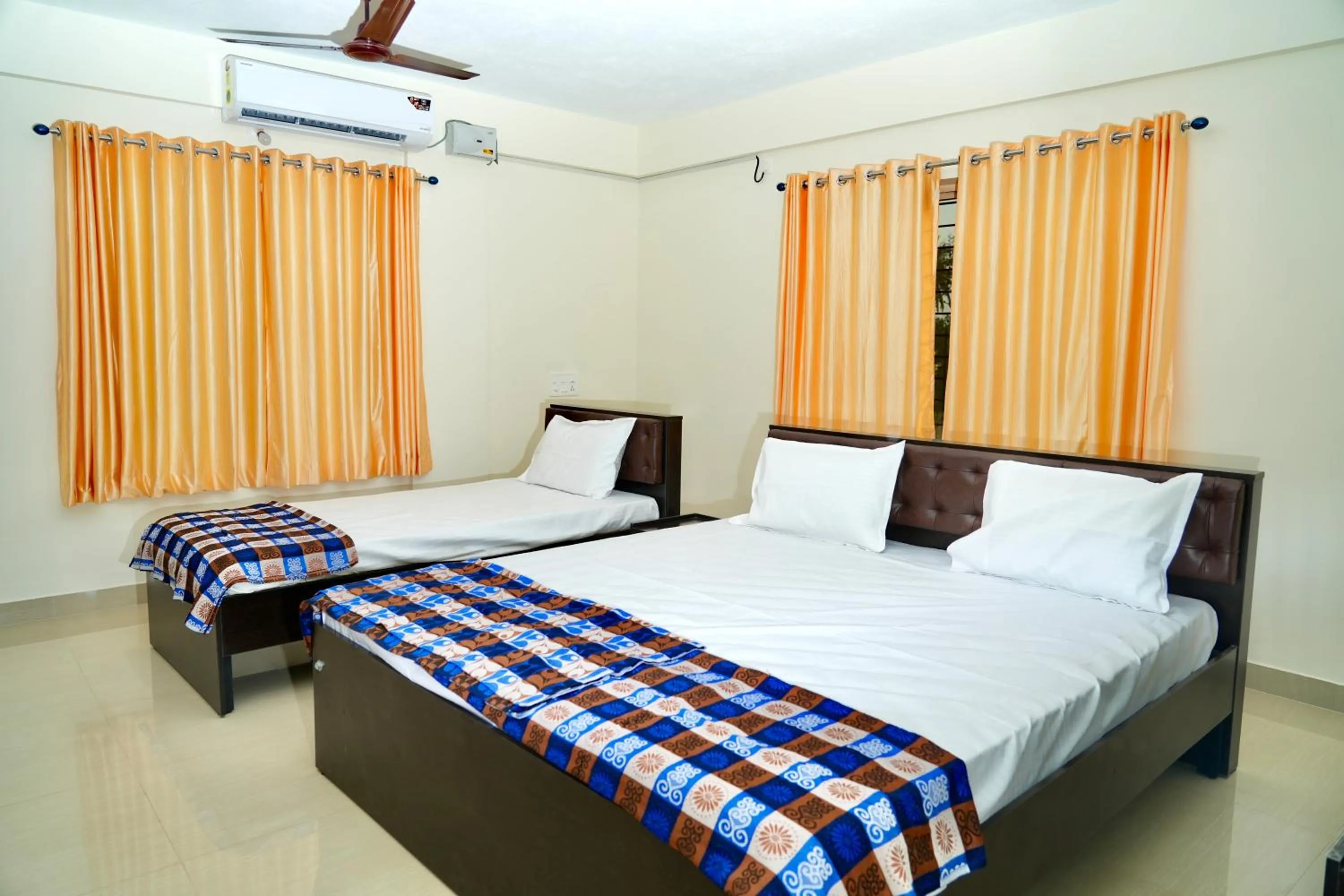 Photo of the whole room, Bed in Shree Swarna Comforts
