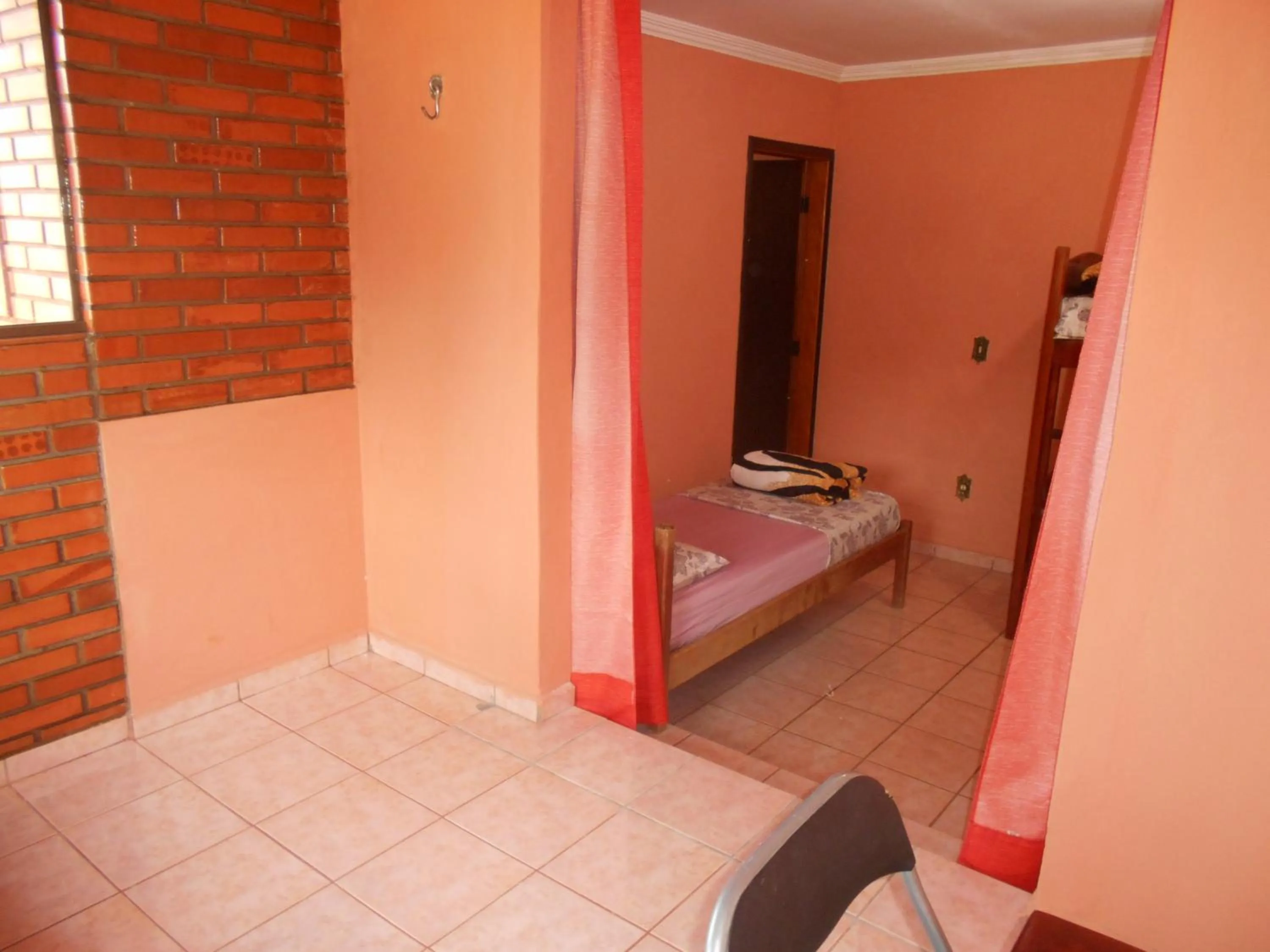 Bed in Pousada Paraiso