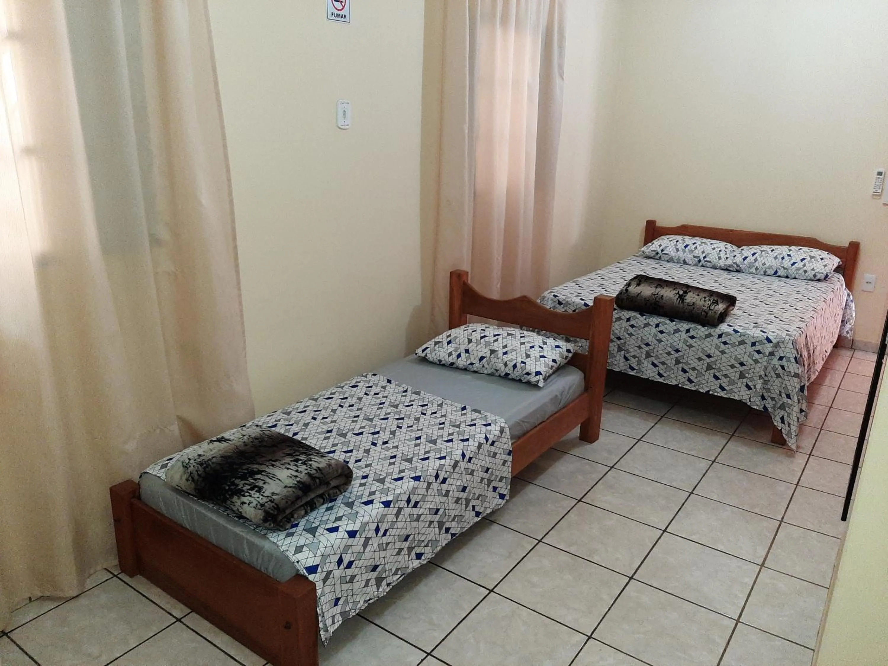 Bed in Pousada Paraiso