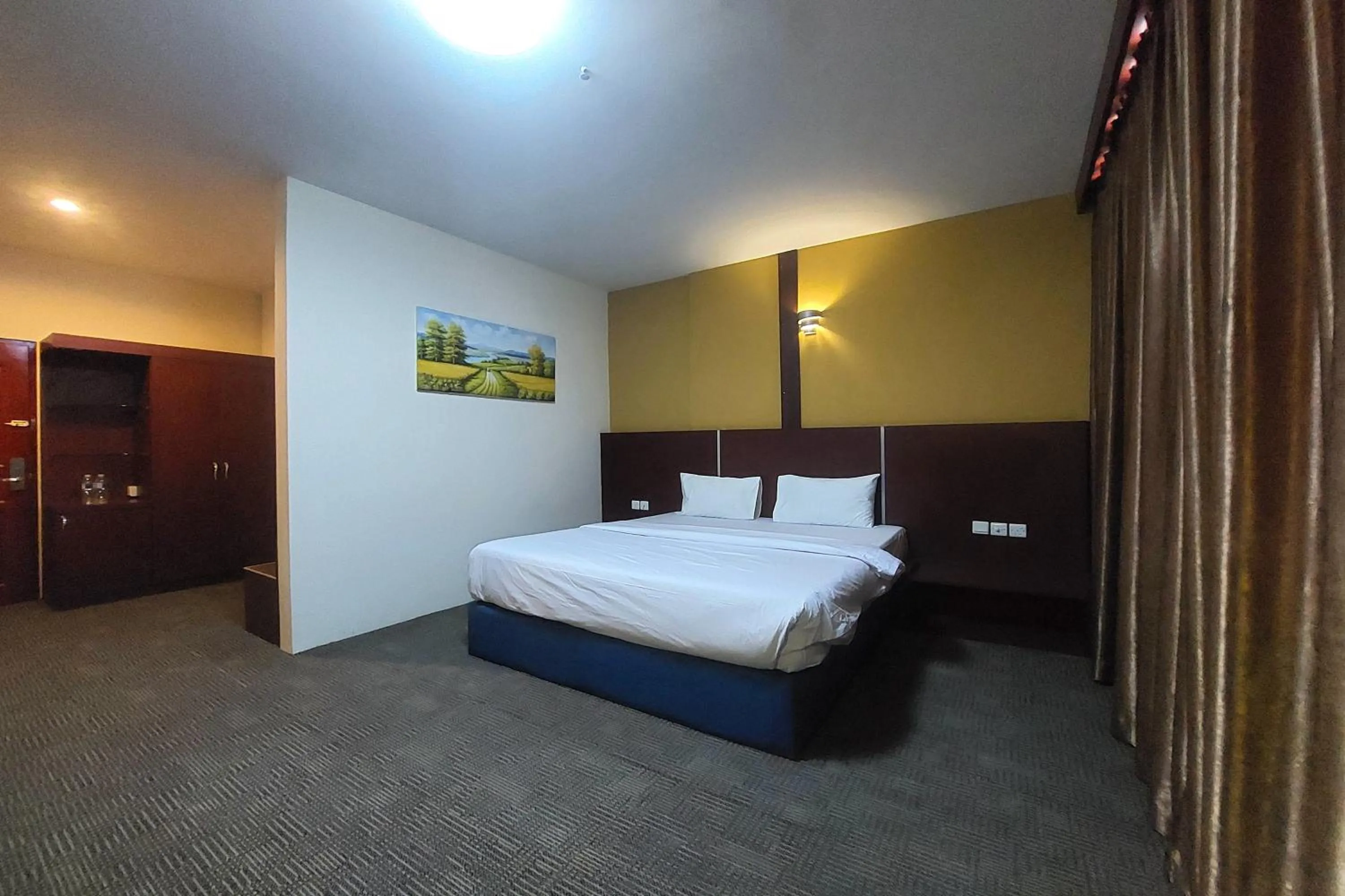 Bedroom in D'MERLION HOTEL