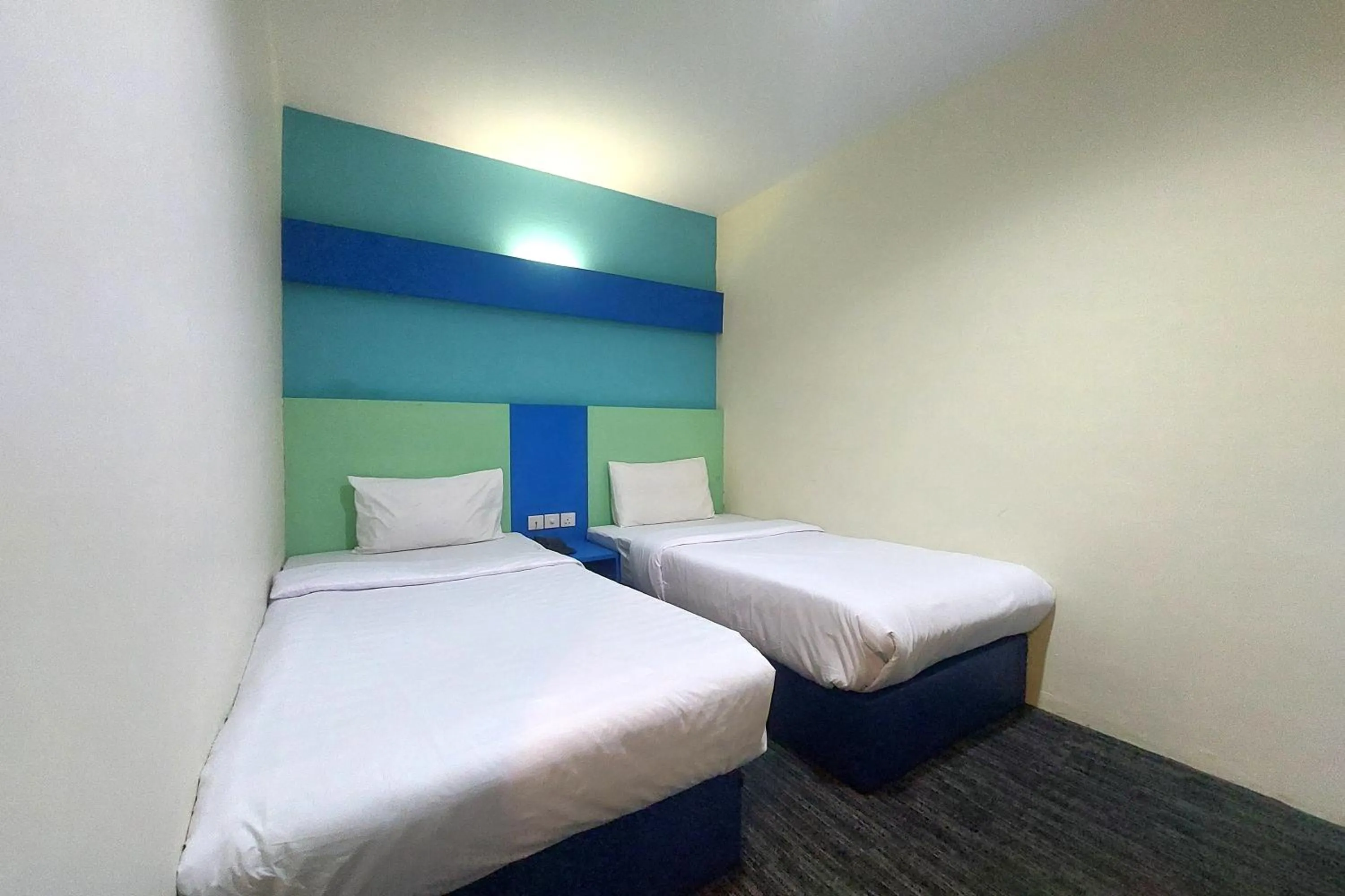 Bedroom in D'MERLION HOTEL