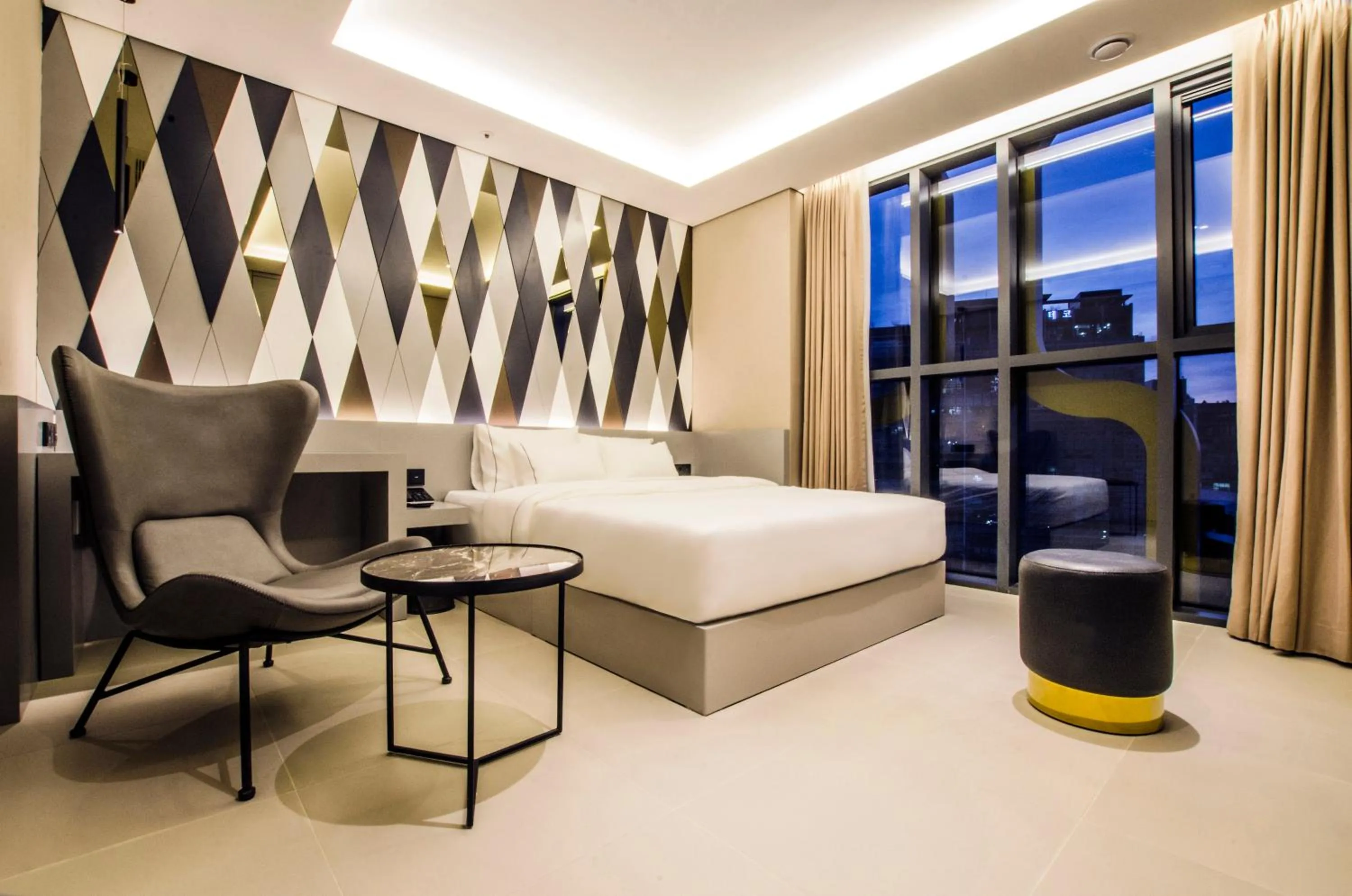 Bed in Hotel The Designers Premier Kondae