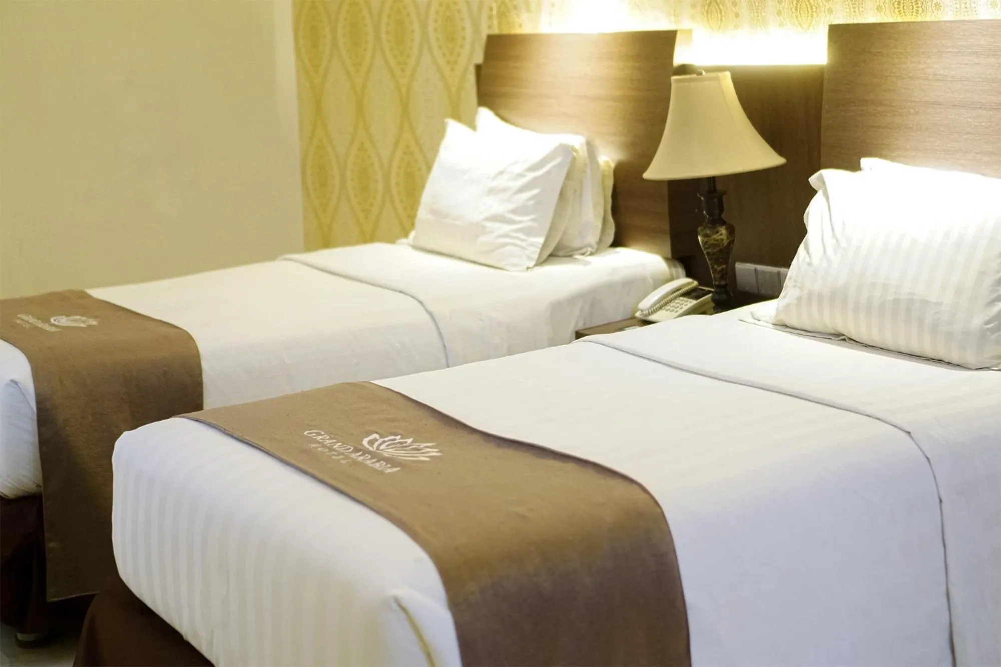 Bed in Portola Grand Arabia Hotel