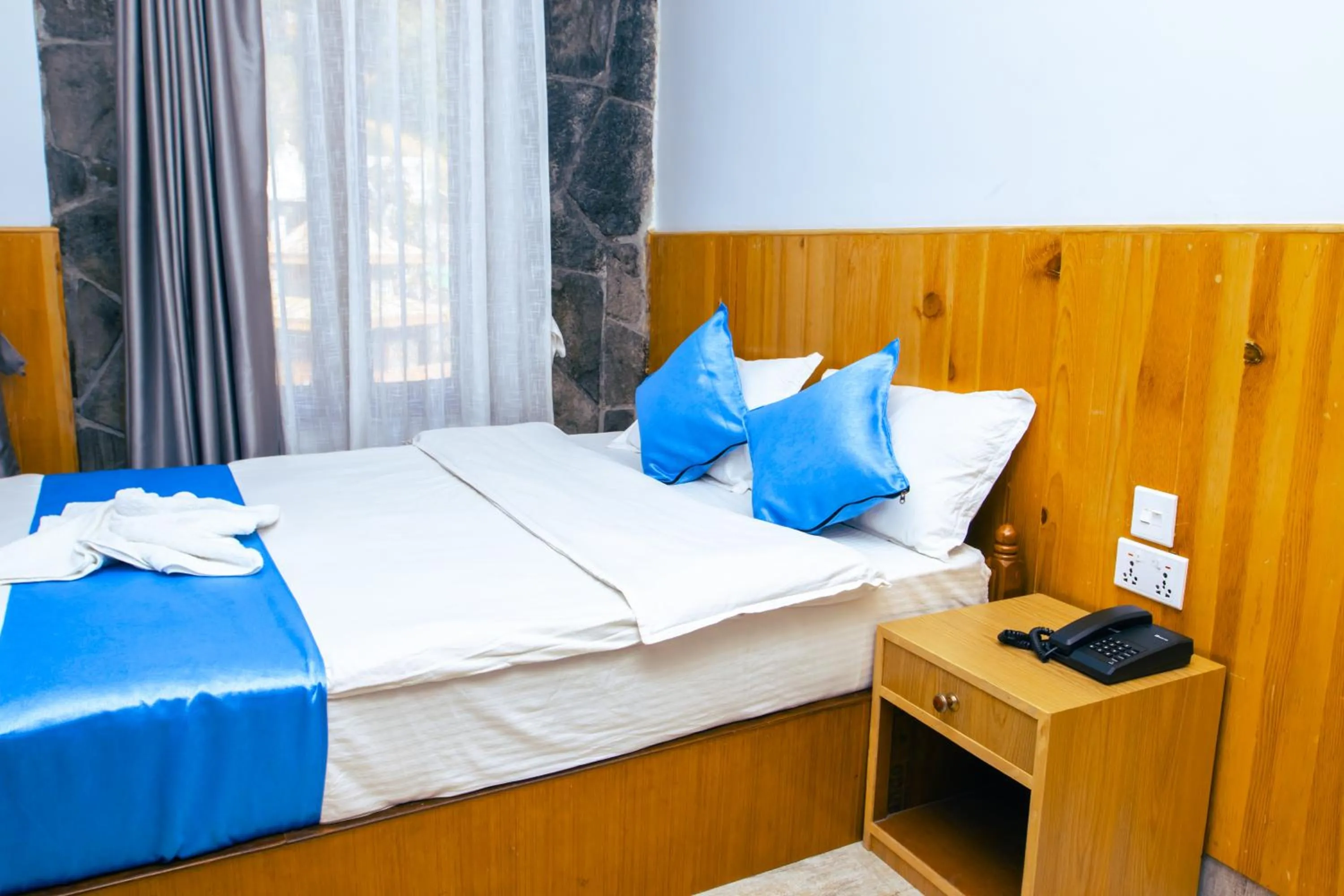 Bed in Roamers Inn