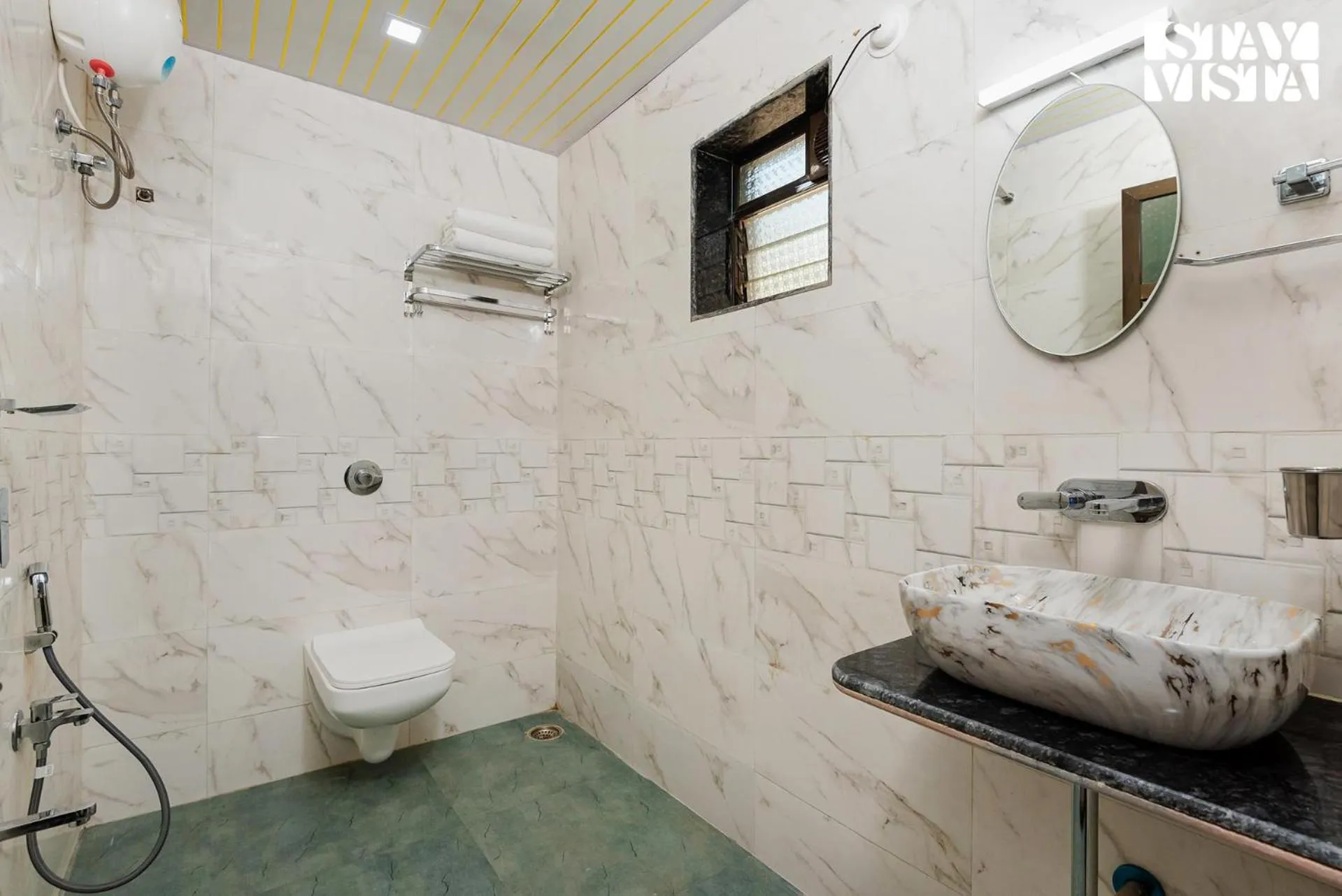 Bathroom in Mango Splash by VEO - Part of StayVista