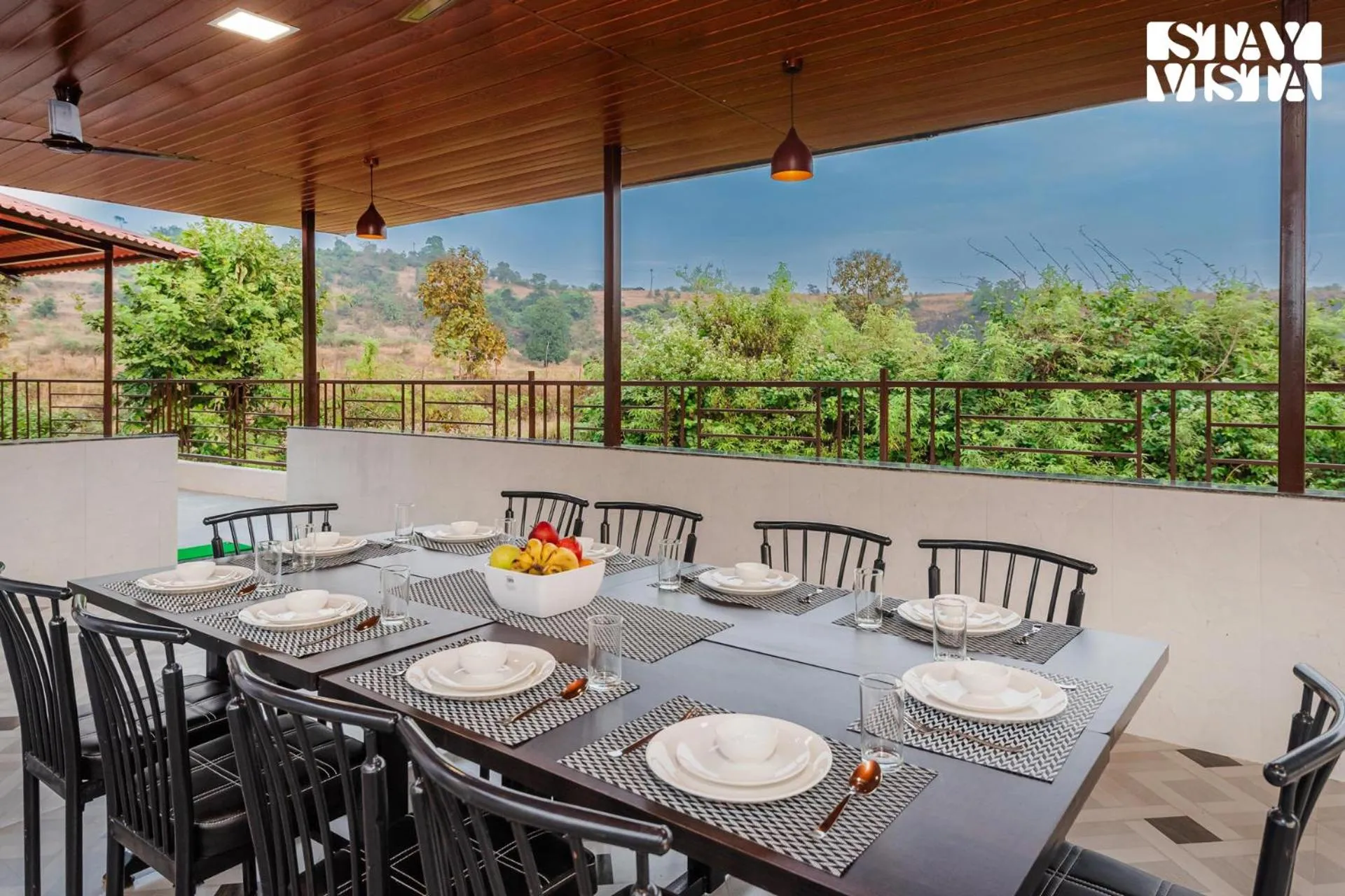 Dining area in Mango Splash by VEO - Part of StayVista