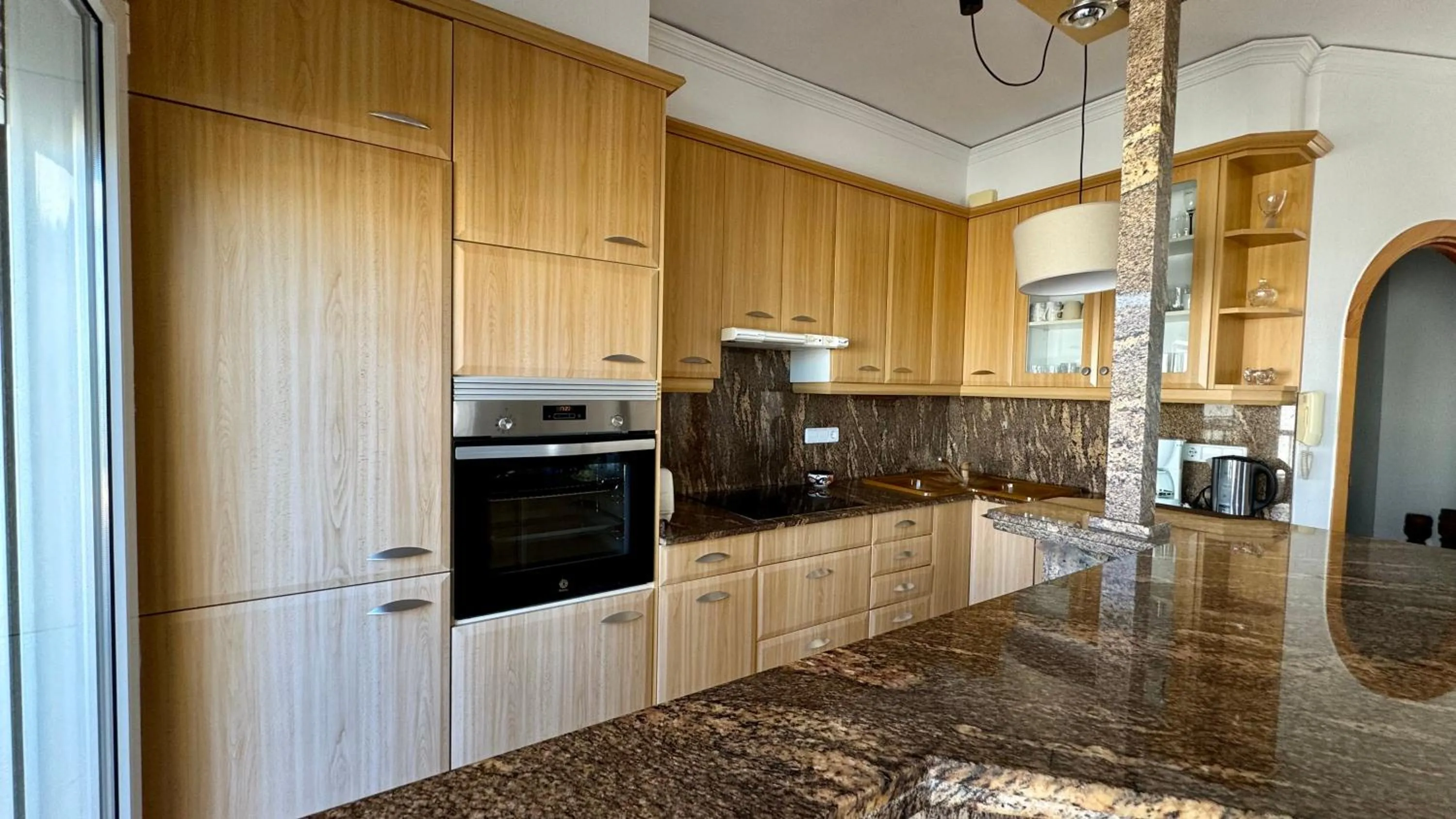 Kitchen or kitchenette in Apartamentos Carlton VyB