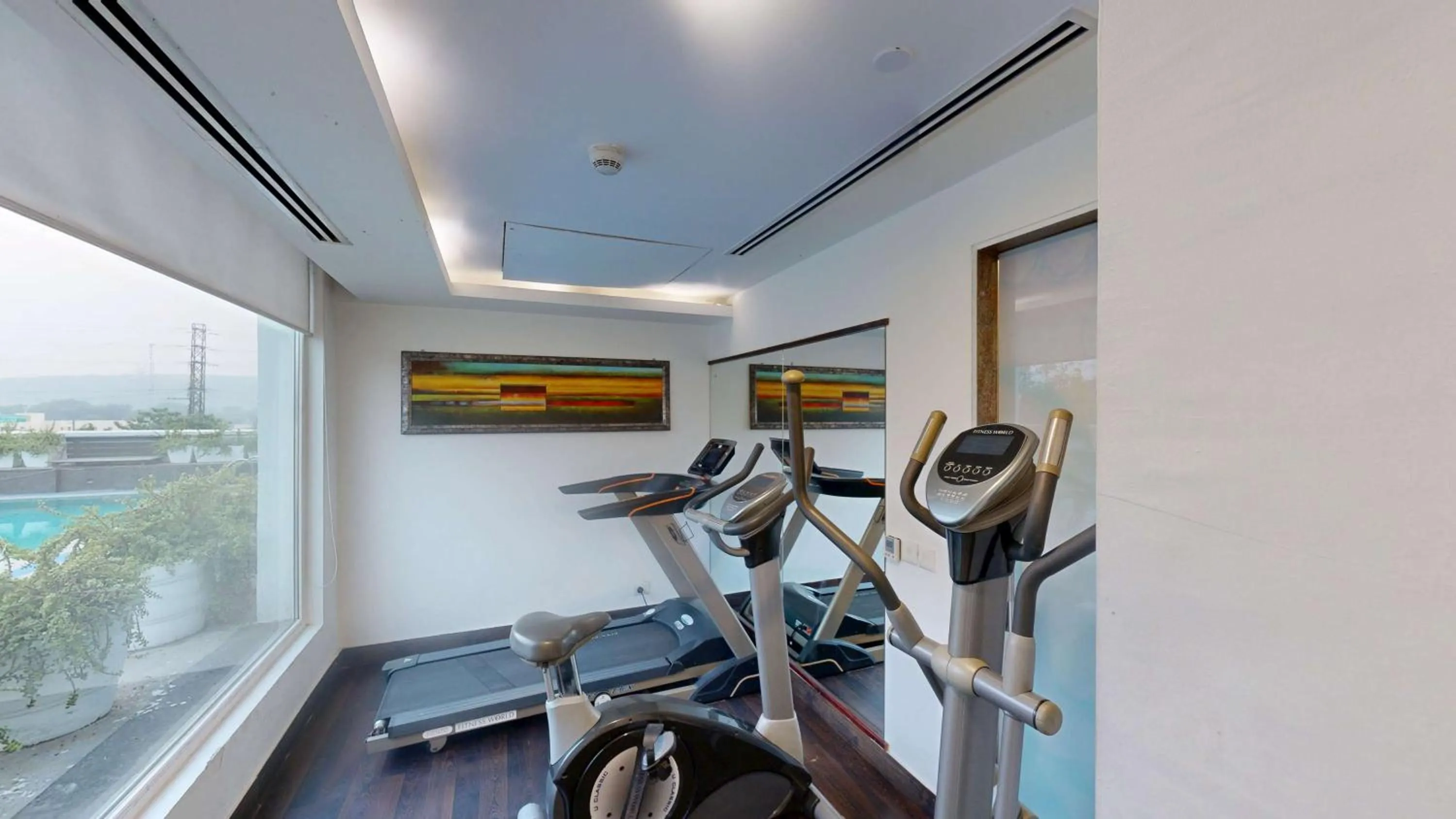 Fitness centre/facilities in Country Inn & Suites by Radisson, Gurugram Sohna Road