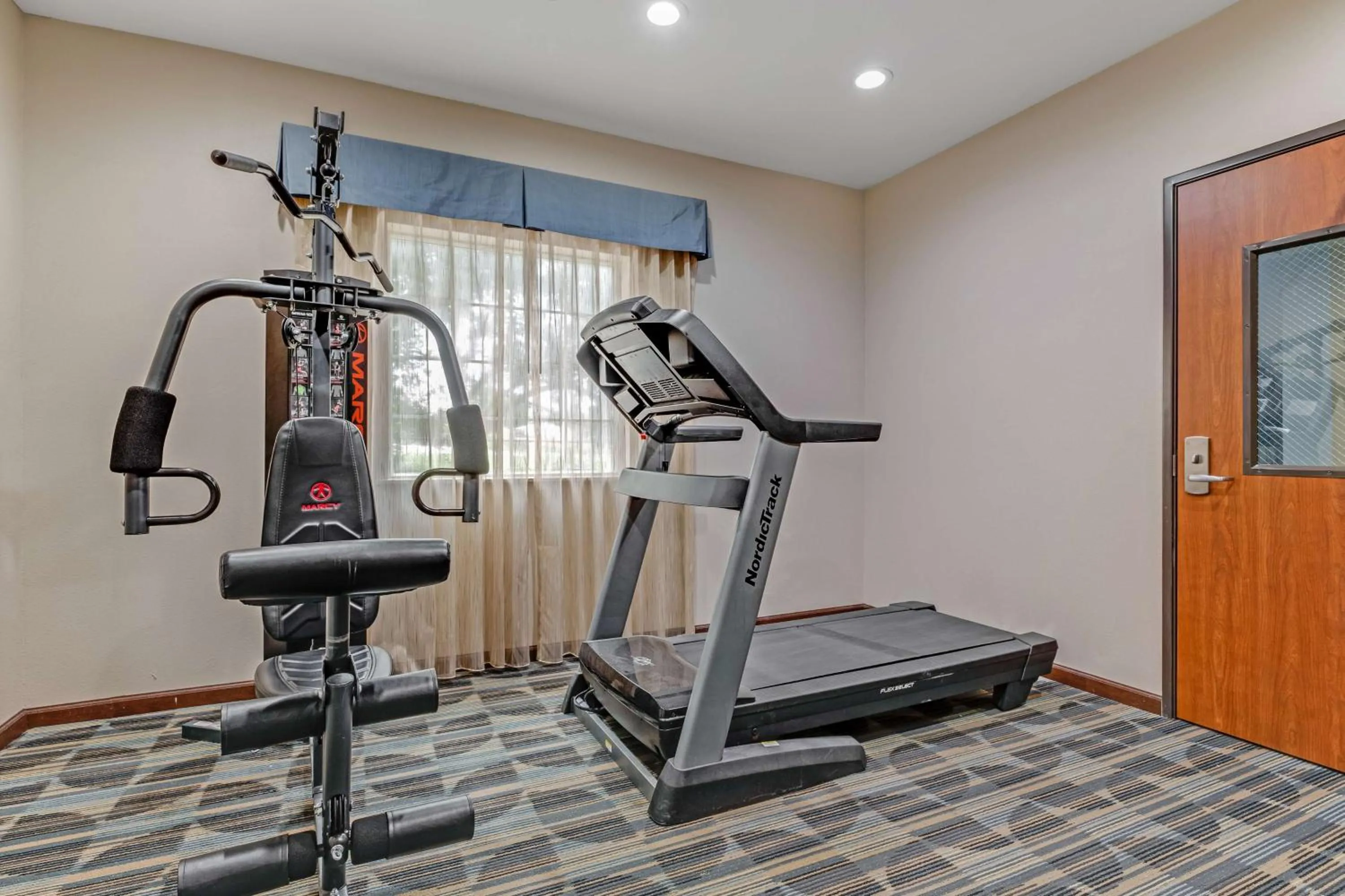 Fitness centre/facilities in SureStay Plus Hotel by Best Western Owasso Tulsa North