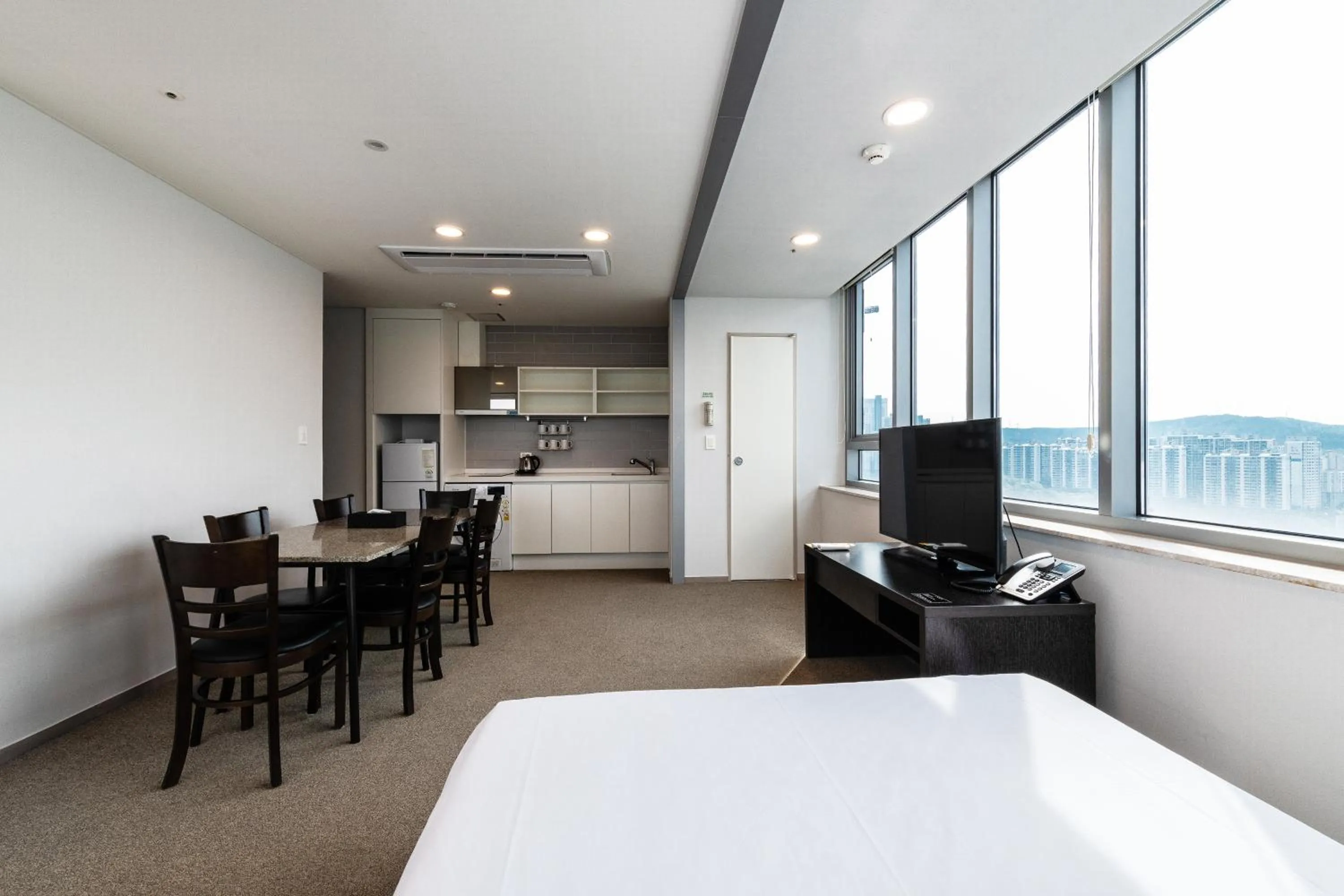 Bed in The Triny Urban Suites