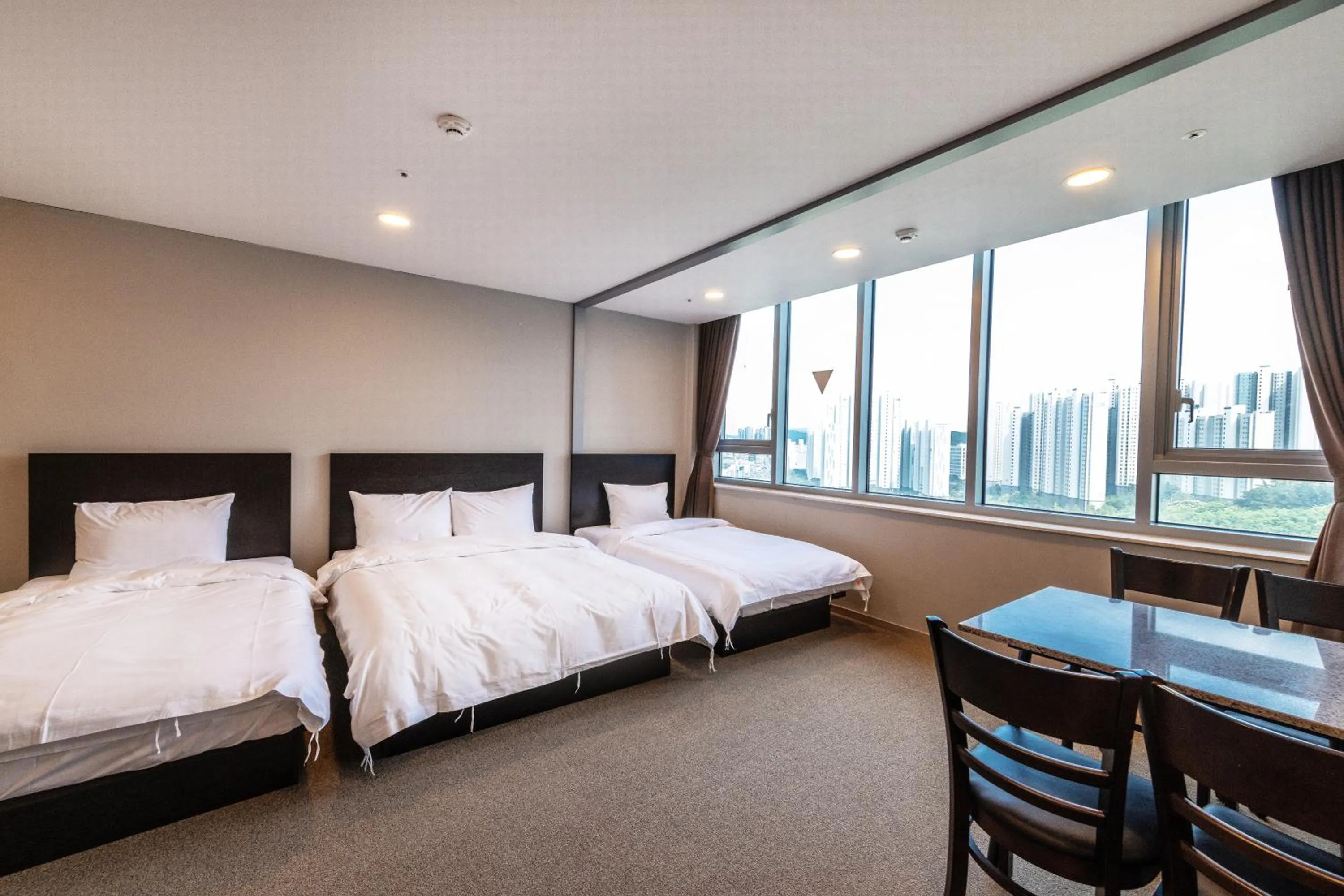 Bed in The Triny Urban Suites