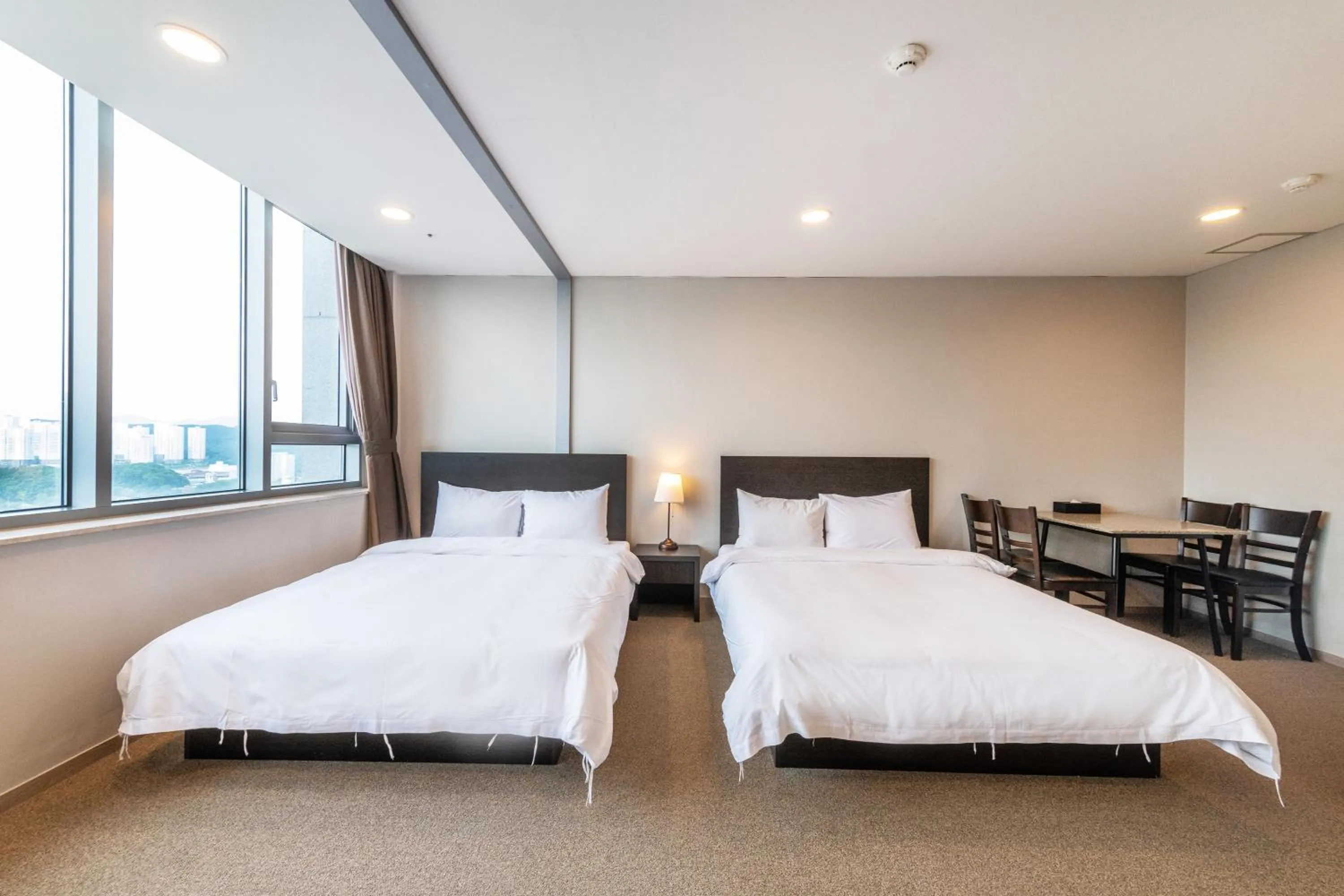 Bed in The Triny Urban Suites