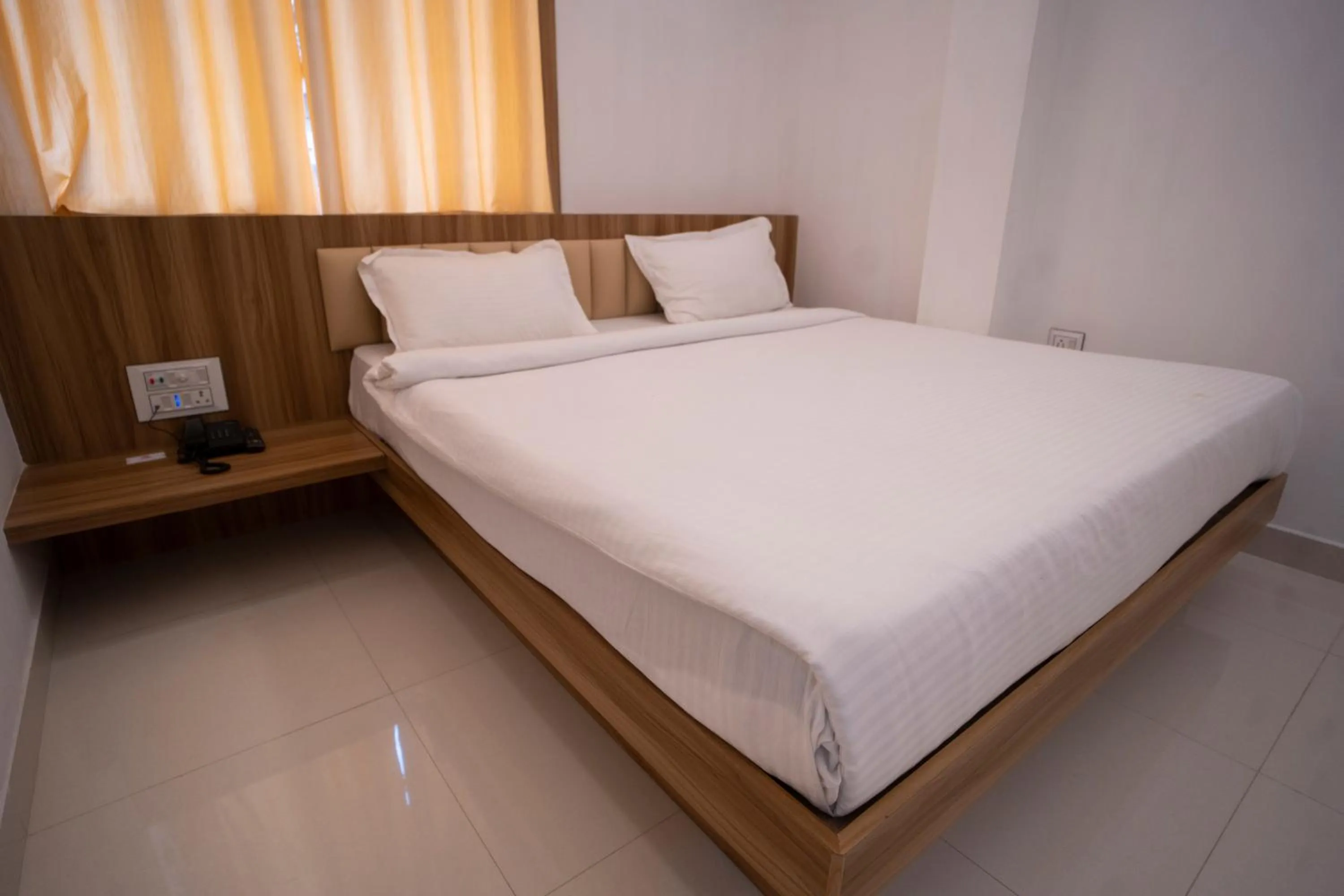 Bed in Hotel Shanti International