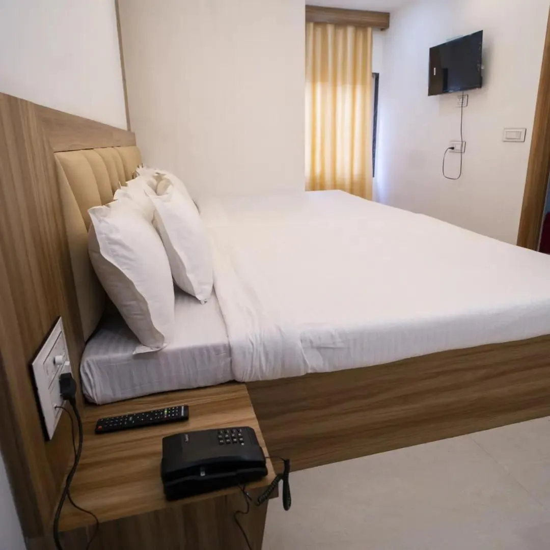 Bed in Hotel Shanti International