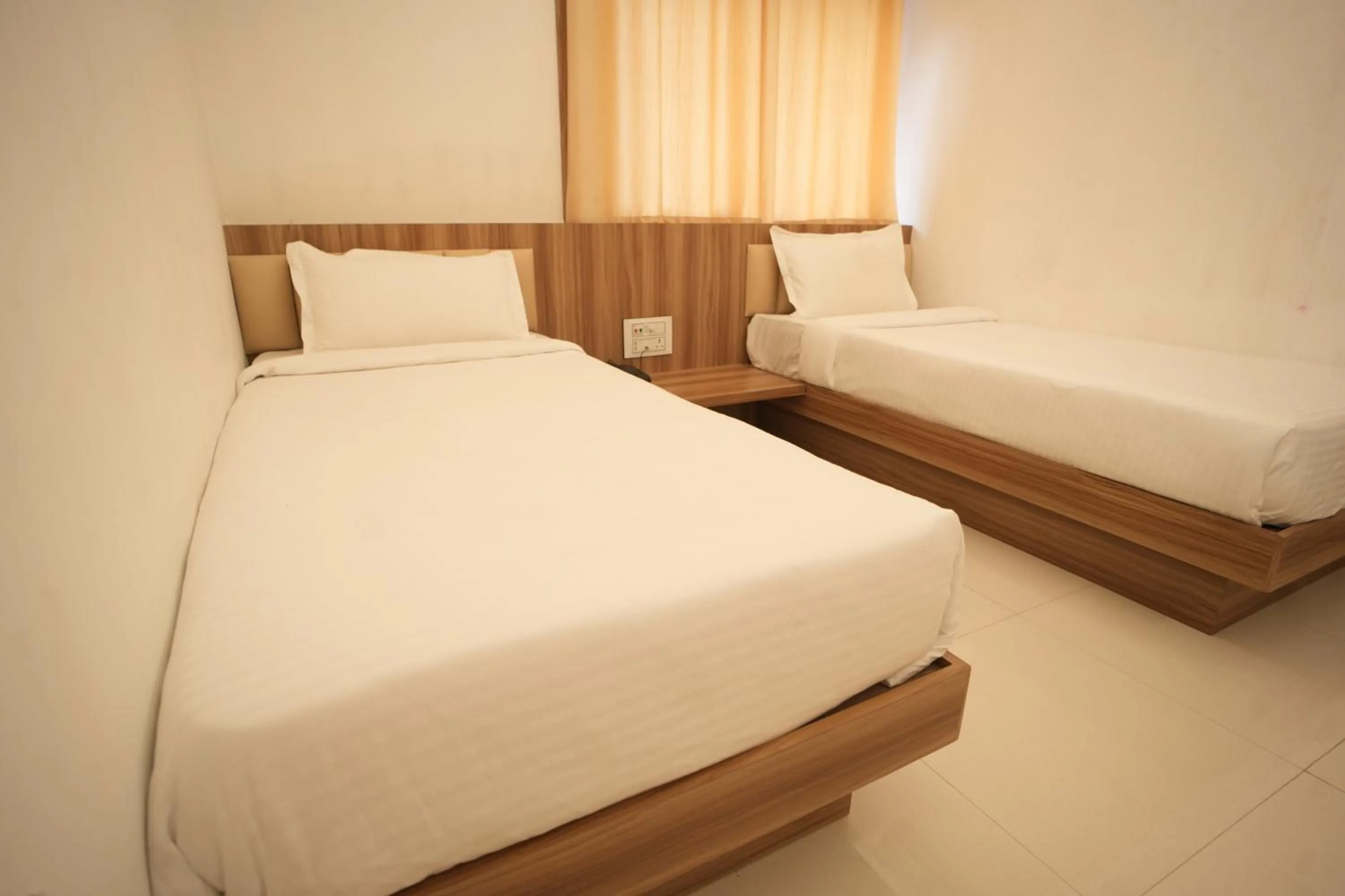 Bed in Hotel Shanti International