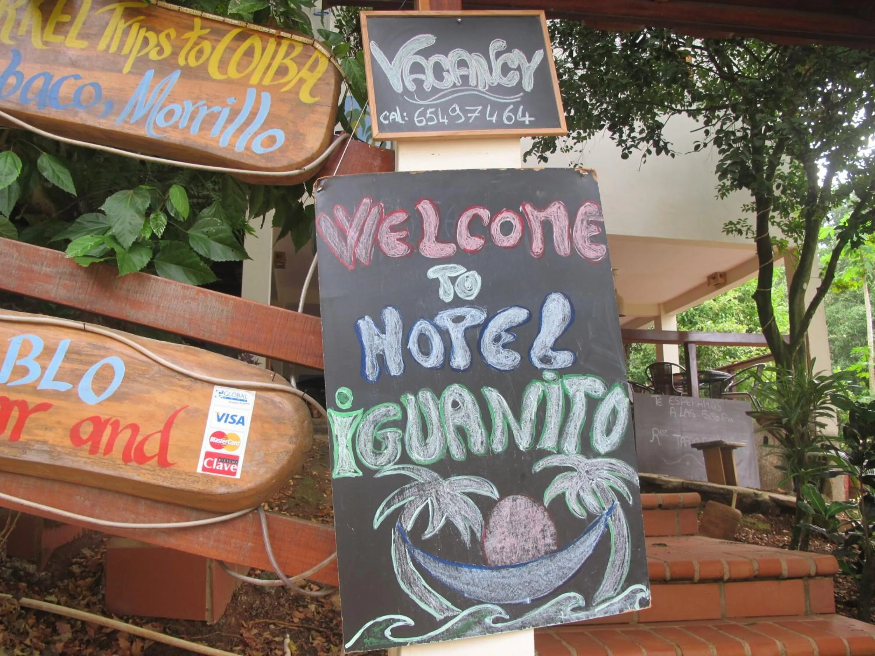 Property logo or sign in Hotel Iguanito