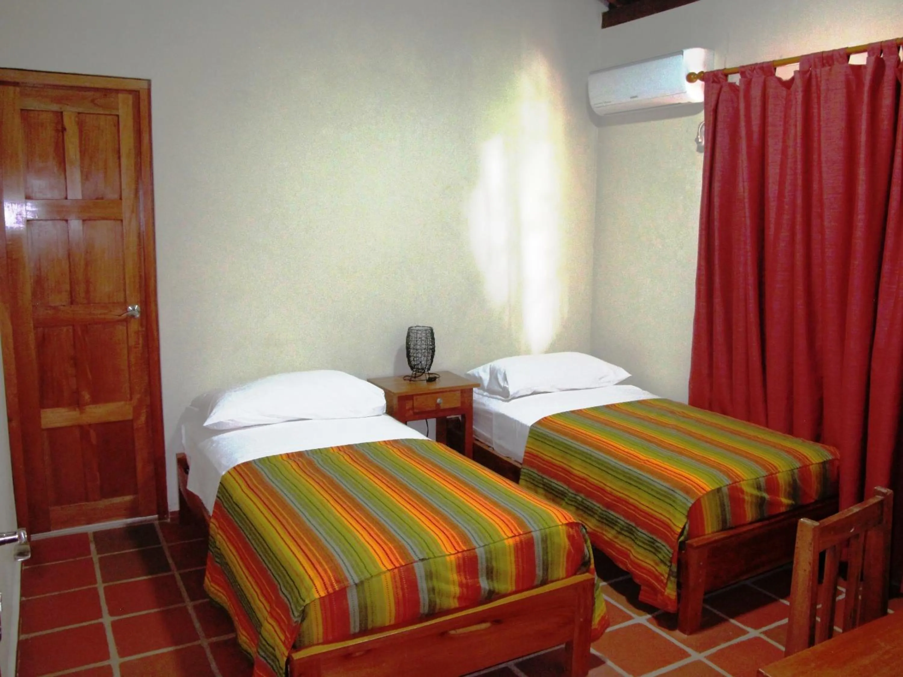 Bed in Hotel Iguanito