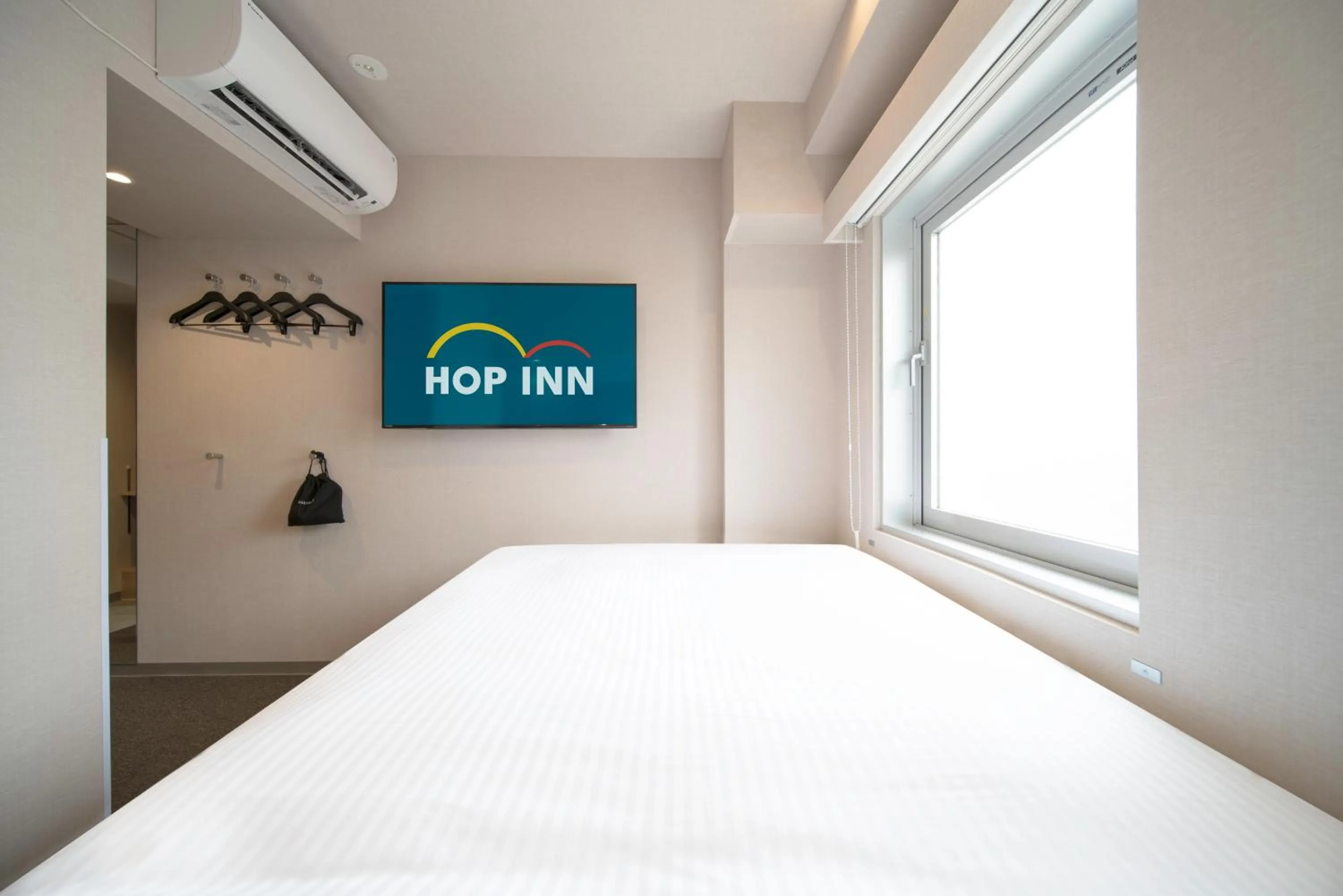 Bed in Hop Inn Tokyo Ueno