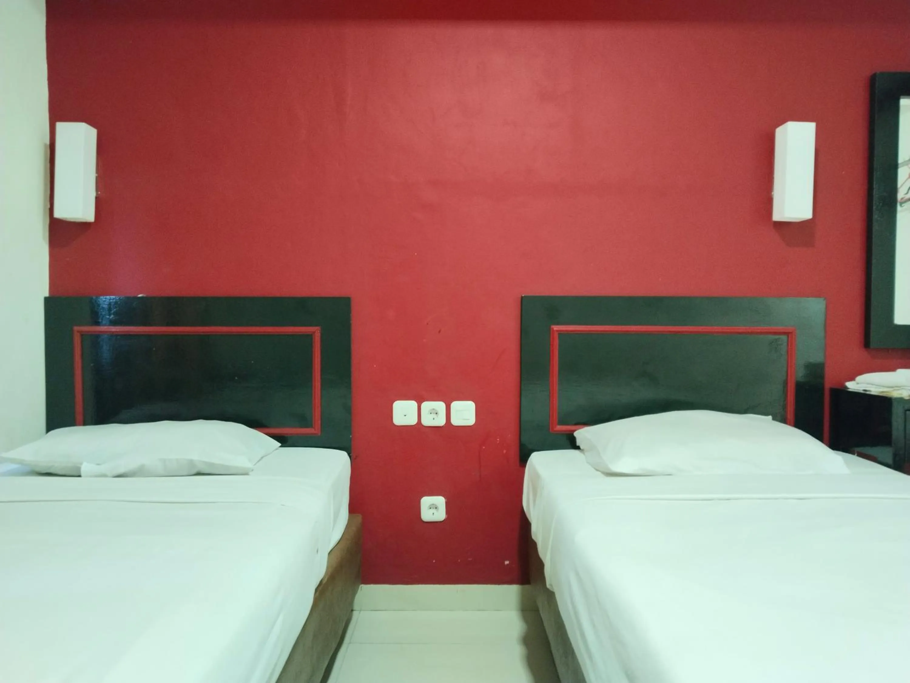 Bed in Metro Hotel Bekasi powered by Cocotel