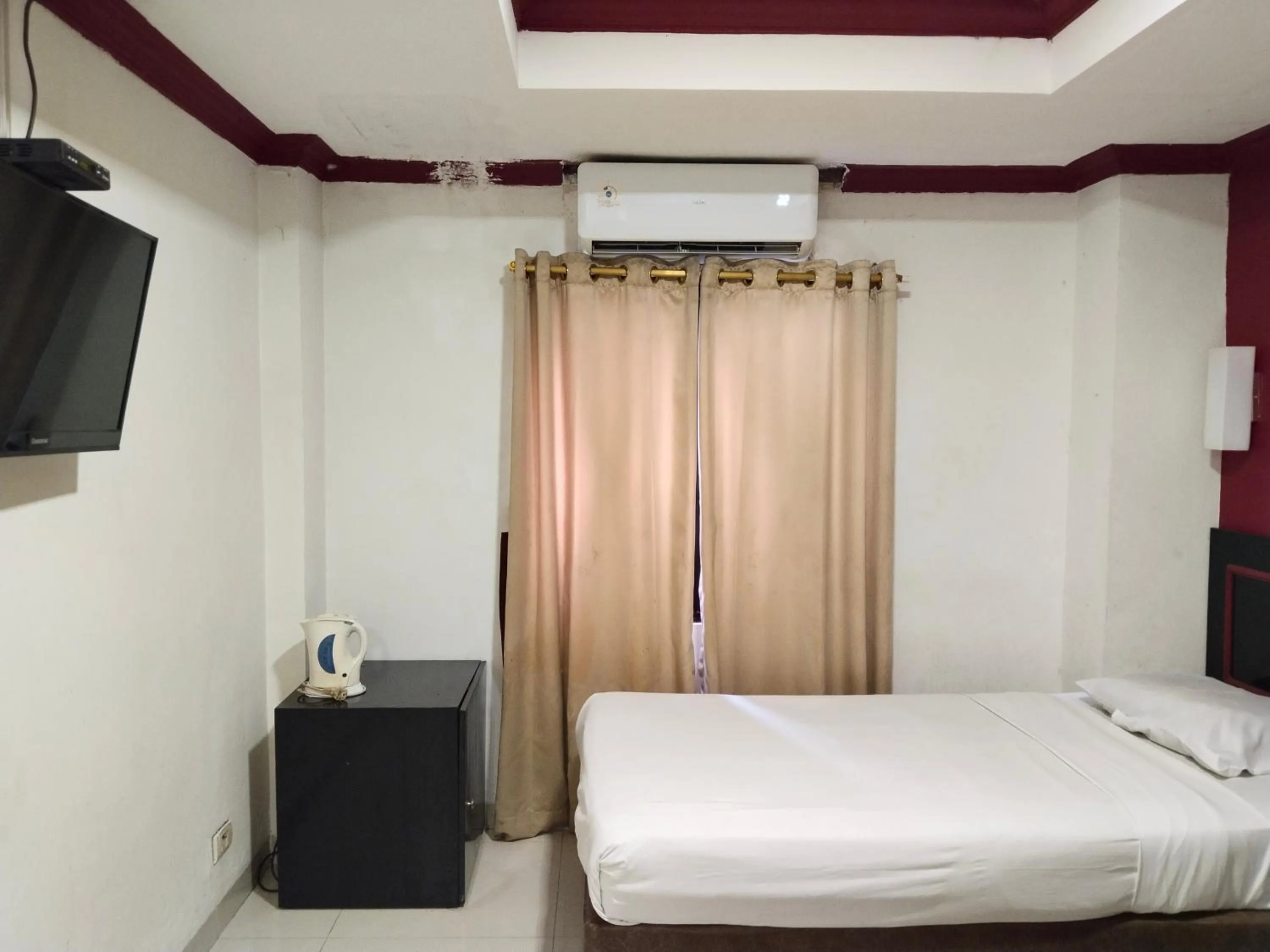 Bed in Metro Hotel Bekasi powered by Cocotel