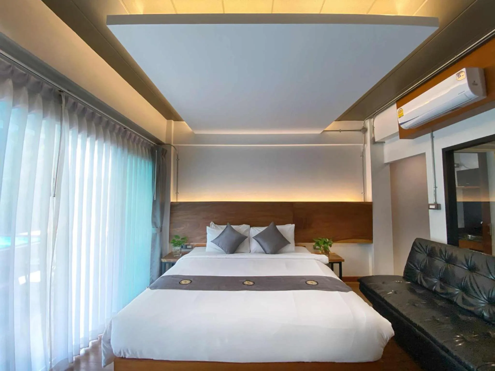 Bed in Lanna Tree Boutique Hotel