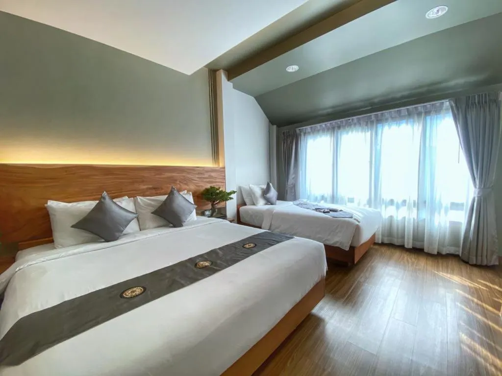 Bed in Lanna Tree Boutique Hotel