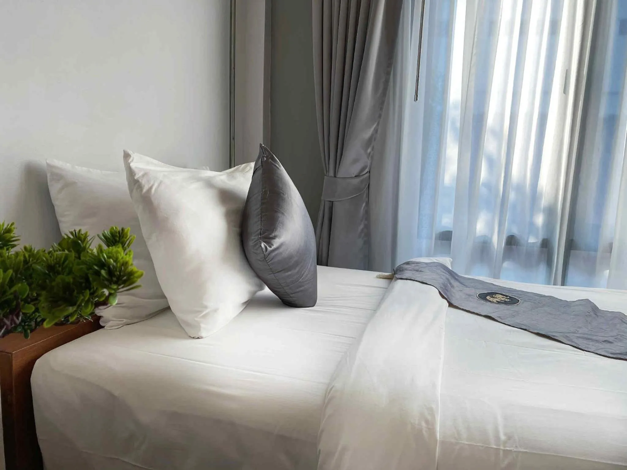 Bed in Lanna Tree Boutique Hotel