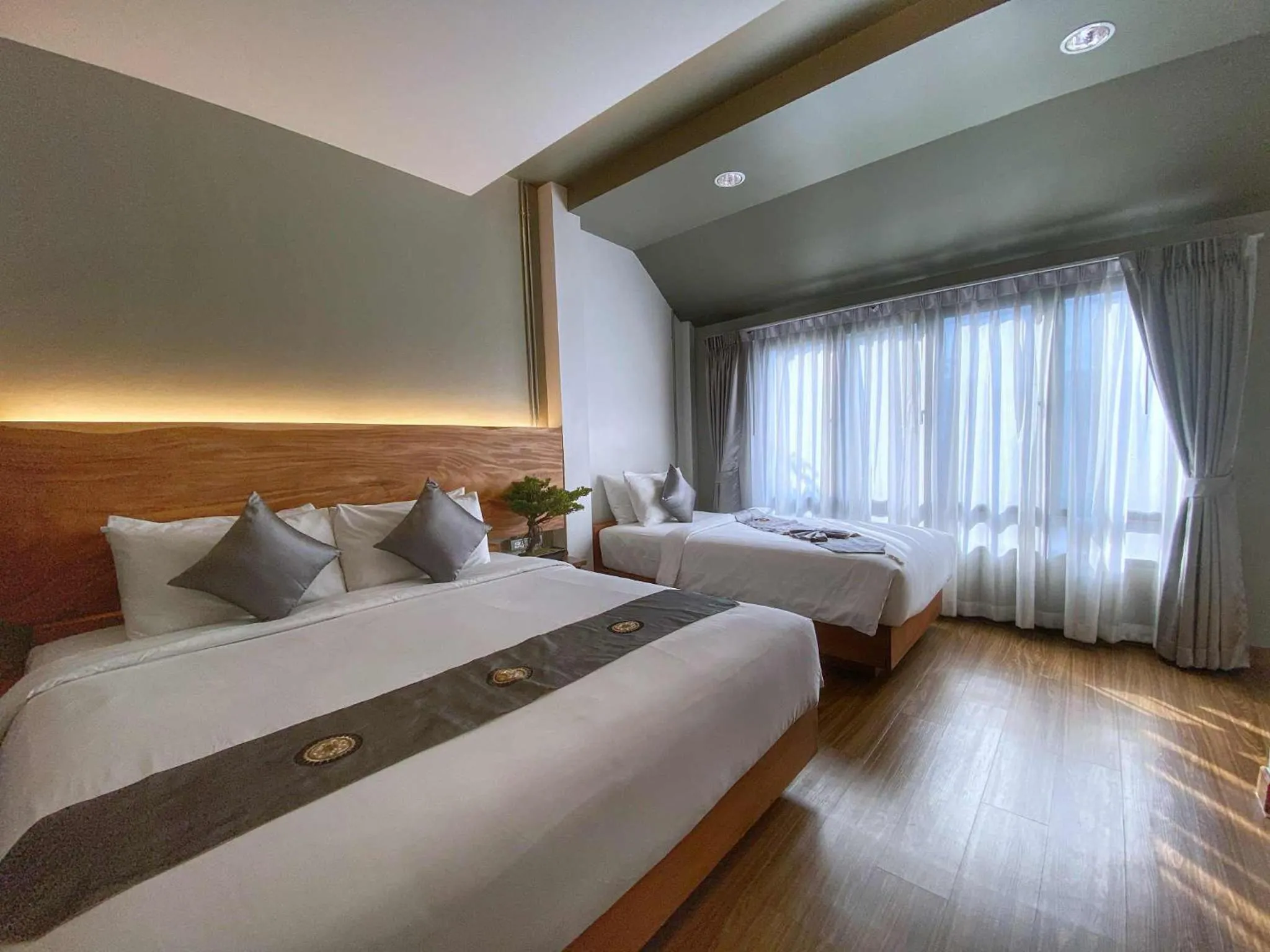 Bed in Lanna Tree Boutique Hotel