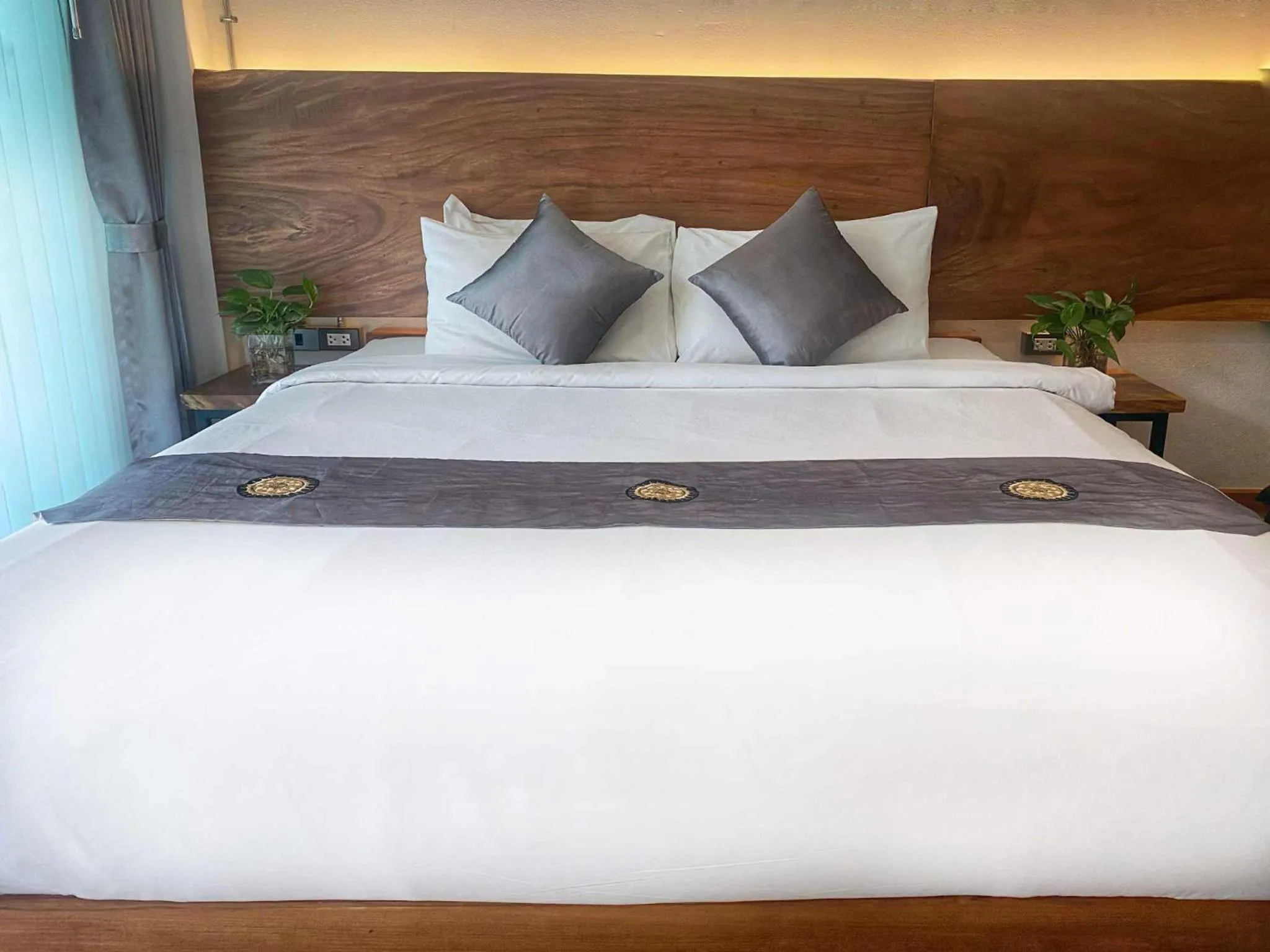 Bed in Lanna Tree Boutique Hotel